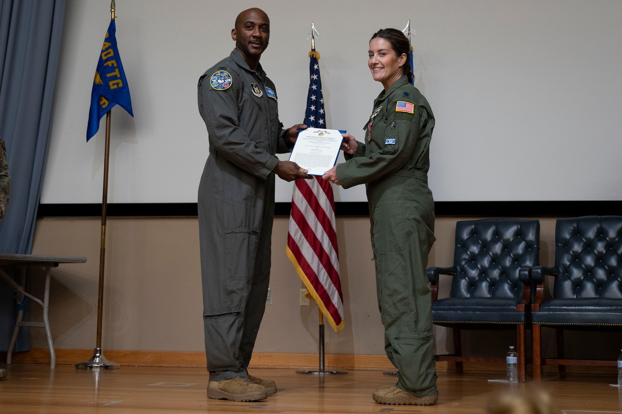 U.S. Air Force Col. Michael McMillan, 340th Flying Training Group director of operations, presents a Meritorious Service Medal to Lt. Col. Christine Van Weezendonk, former 96th Flying Training Squadron commander, during the 96th FTS change of command ceremony at Laughlin Air Force Base, Texas, May 10, 2024. The Meritorious Service Medal was established as the counterpart of the Bronze Star Medal for the recognition of meritorious noncombatant service. (U.S. Air Force photo by Senior Airman Kailee Reynolds)