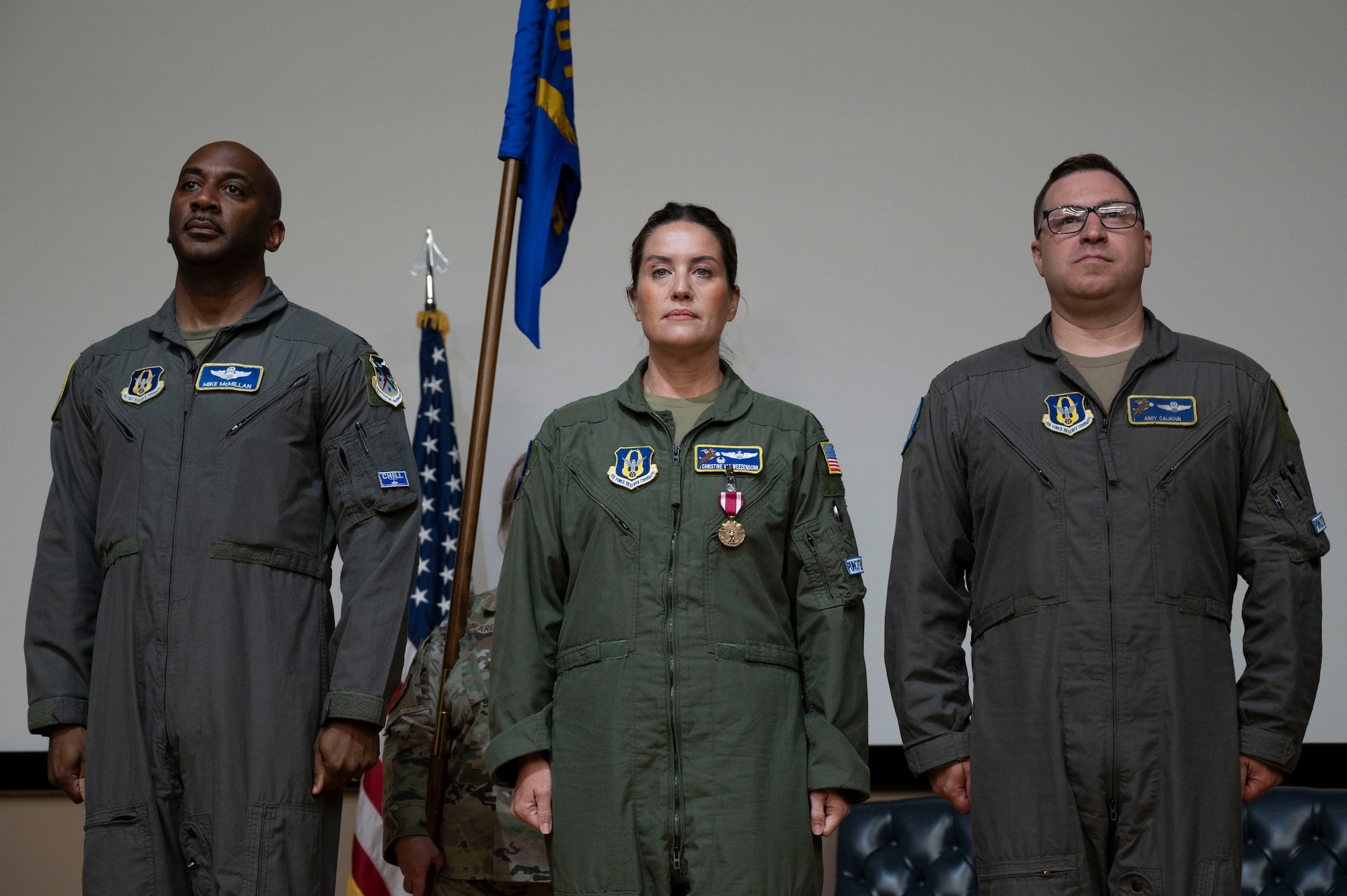 (From left to right) U.S. Air Force Col. Michael McMillan, 340th Flying Training Group director of operations, Lt. Col. Christine Van Weezendonk, former 96th Flying Training Squadron commander, and Lt. Col. Andrew Calhoun, current 96th FTS commander, stand at attention during the publication of the change of command orders during the 96th FTS change of command ceremony at Laughlin Air Force Base, Texas, May 10, 2024. Change of command ceremonies represent a formal transfer of authority and responsibility for a unit from one commanding officer to another. (U.S. Air Force photo by Senior Airman Kailee Reynolds)