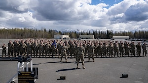 The U.S. Air Force 3rd Munitions Squadron poses for a photo after a coining ceremony in recognition of the squadron earning the Maintenance Effectiveness Award at the Headquarters Air Force level, at Joint Base Elemendorf-Richardson, Alaska, May 14, 2024.