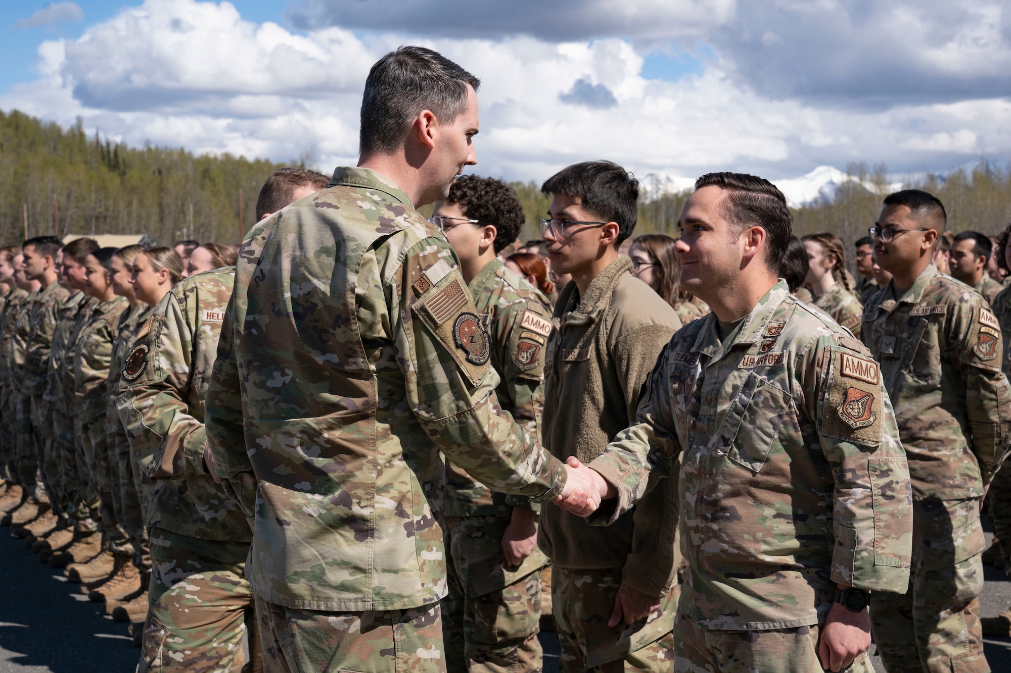 3rd Munitions Squadron commander, coins Staff Sgt. Dyson Clement, a munitions systems specialist assigned to 3rd MUNS, during a squadron coining ceremony in recognition of the squadron earning the Maintenance Effectiveness Award at the Headquarters Air Force level, at Joint Base Elemendorf-Richardson, Alaska, May 14, 2024