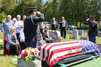 New York Army National Guard Sgt. Carlos Garcia, left, and Spc. Samantha Bruce, perform military funeral honors at the burial of Wilfred “Spike” Mailloux, a 100-year old New York National Guard veteran of the World War II Battle of Saipan, at St. Michael’s Cemetery in Waterford, New York, May 7, 2024. Mailloux survived the war’s largest Japanese banzai attack, which killed 502 Soldiers in the New York National Guard’s 105th Infantry Regiment on July 7, 1944.