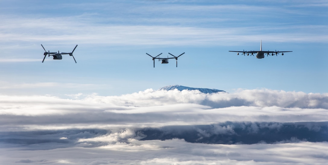 U.S. Marine MV-22B Ospreys and a KC-130J Hercules with Marine Medium Tiltrotor Squadron 261 (VMM-261) fly over the peak of Mount Kilimanjaro, May 10, 2024. VMM-261 and the KC-130J Detachment, "Bronco" flew to Mount Kilimanjaro, Tanzania while conducting training.