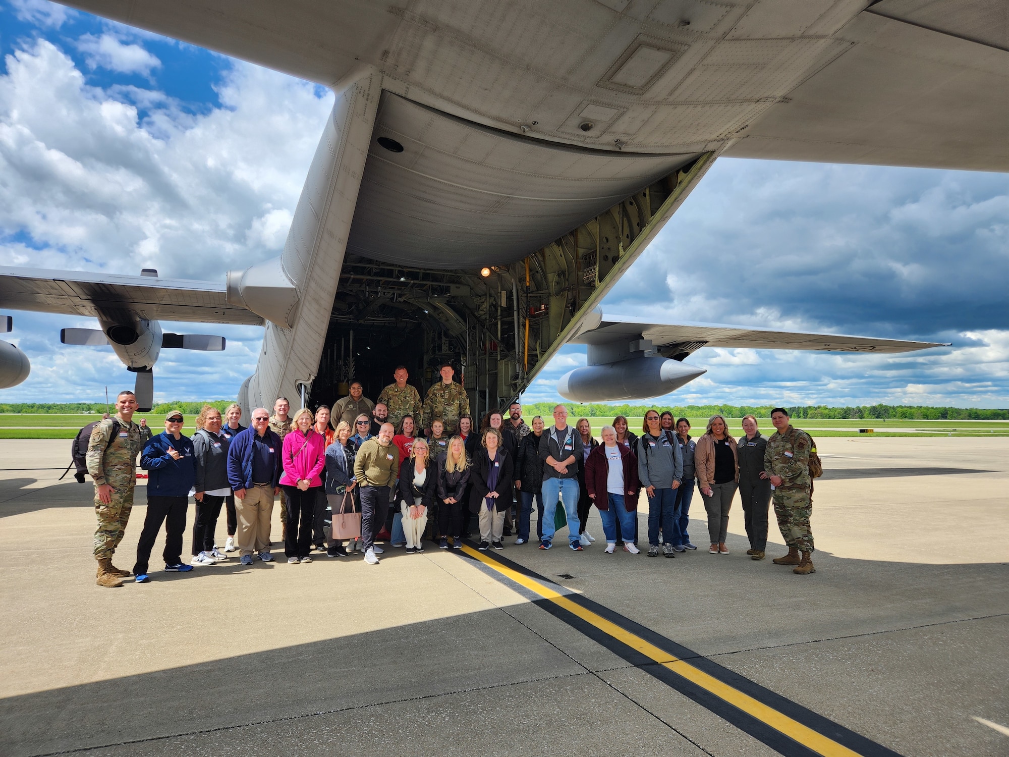Reserve Citizen Airmen assigned to the 910th Airlift Wing and local educators from the Youngstown Air Reserve Station recruitment area pose for a group photo in front of a C-130H Hercules at Youngstown Air Reserve Station, Ohio, May 10, 2024.