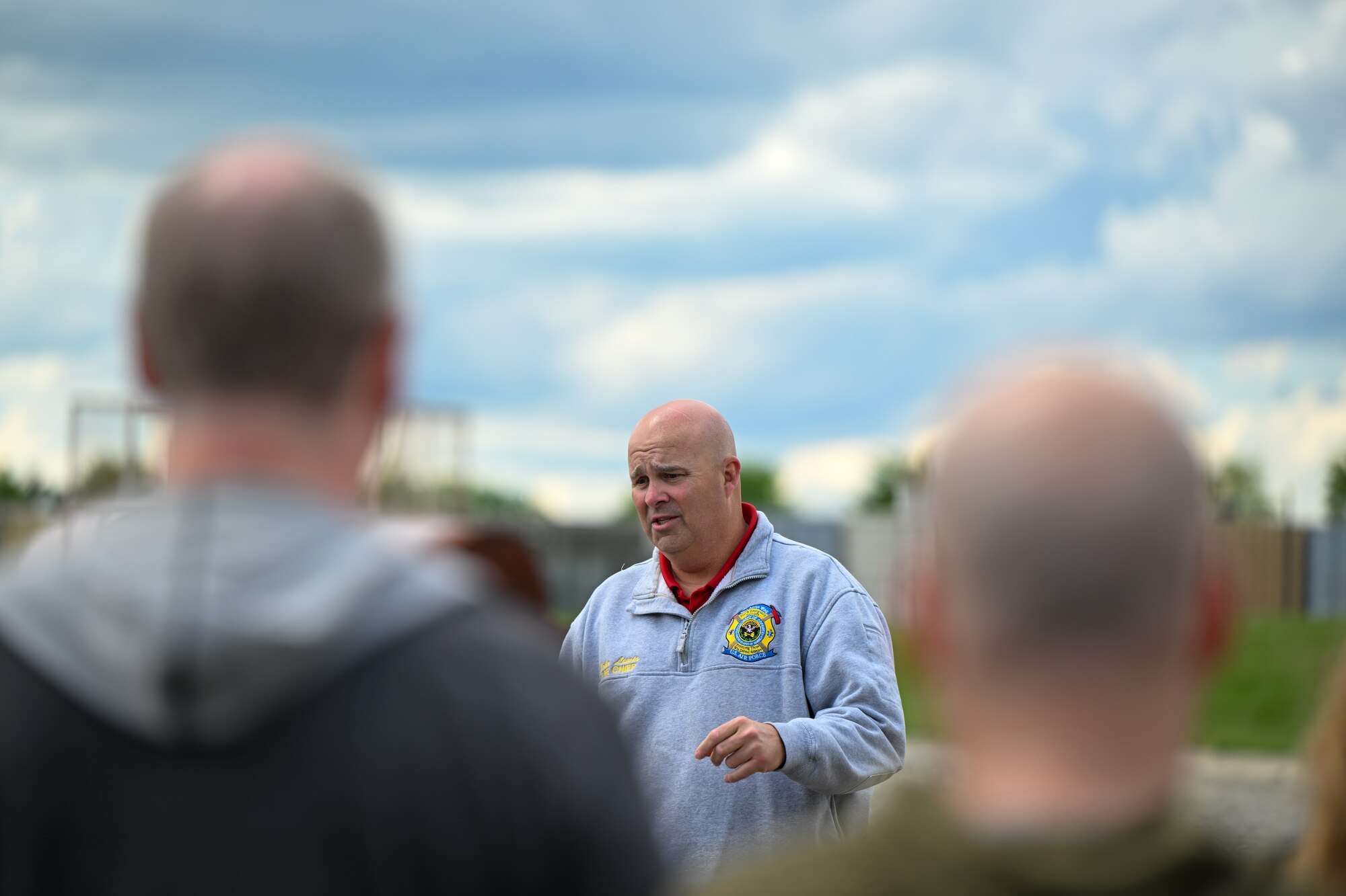 John Lewis, chief of Youngstown Air Reserve Station’s fire department, discusses emergency response capabilities with guests of an educator event at YARS, May 10, 2024.