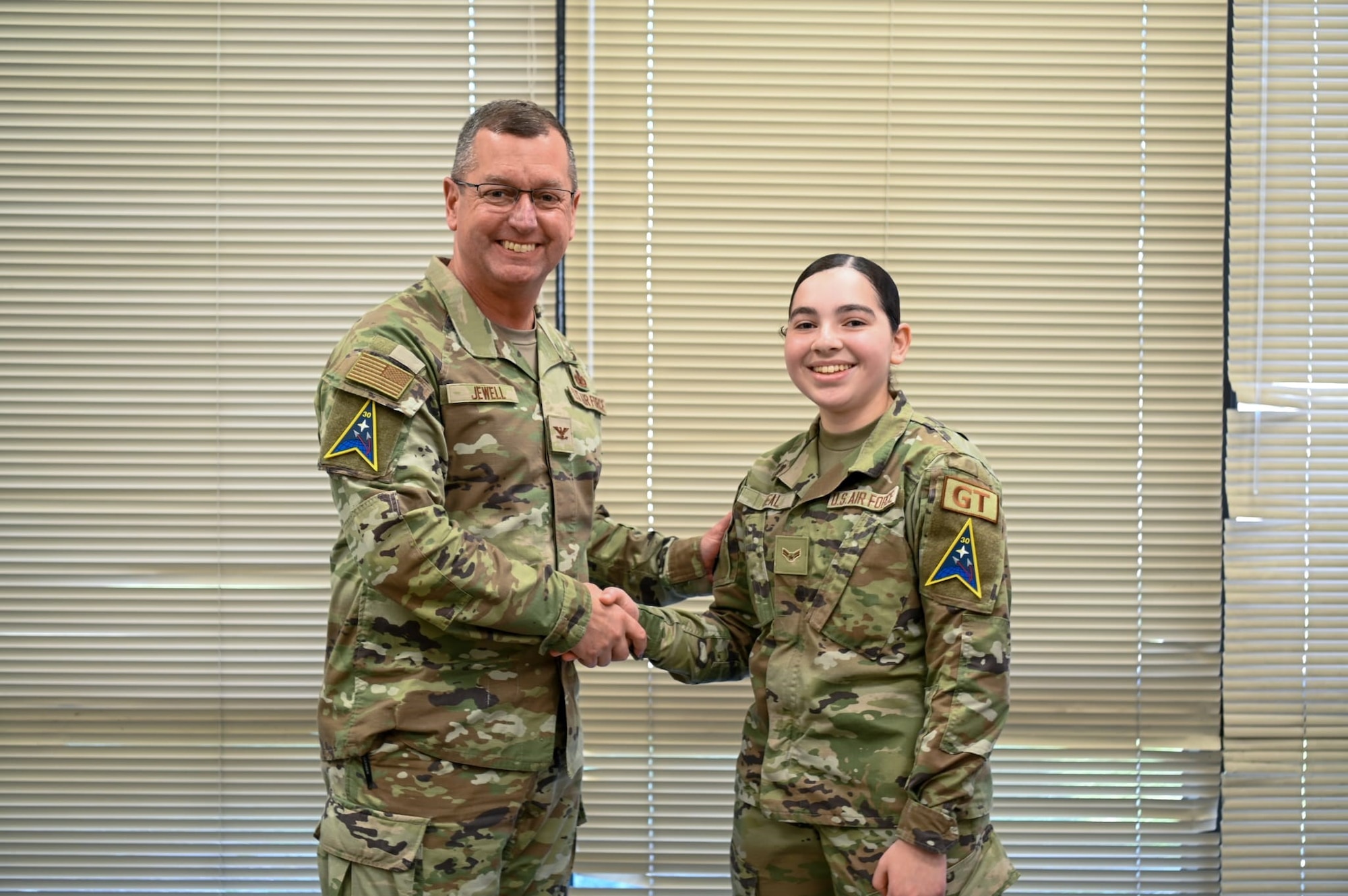 Space Launch Delta 30 vice commander and a 30th Logistics Readiness Squadron ground transportation dispatcher pose for a photo at Vandenberg Space Force Base, Calif.