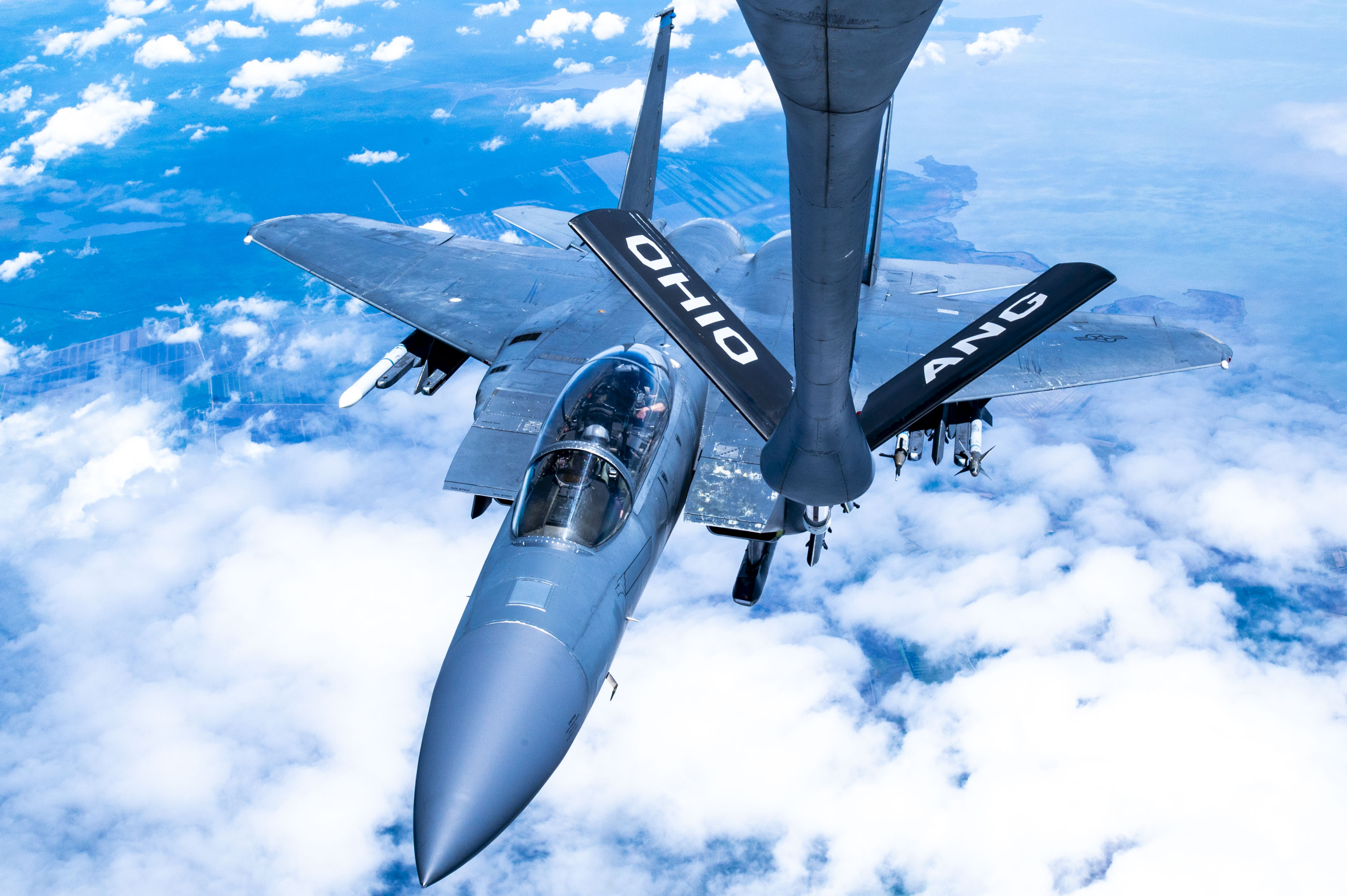 An F-15E Strike Eagle with the 4th Fighter Wing approaches a KC-135 Stratotanker from the 121st Air Refueling Wing to be refueled over the skies of North Carolina, May 7, 2024. The F-15E is a dual-role fighter designed to perform air-to-air and air-to-ground missions with an array of avionics and electronics systems that give it the capability to fight at low altitudes, day or night, and in all weather. (U.S. Air National Guard photo by Senior Airman Ivy Thomas)