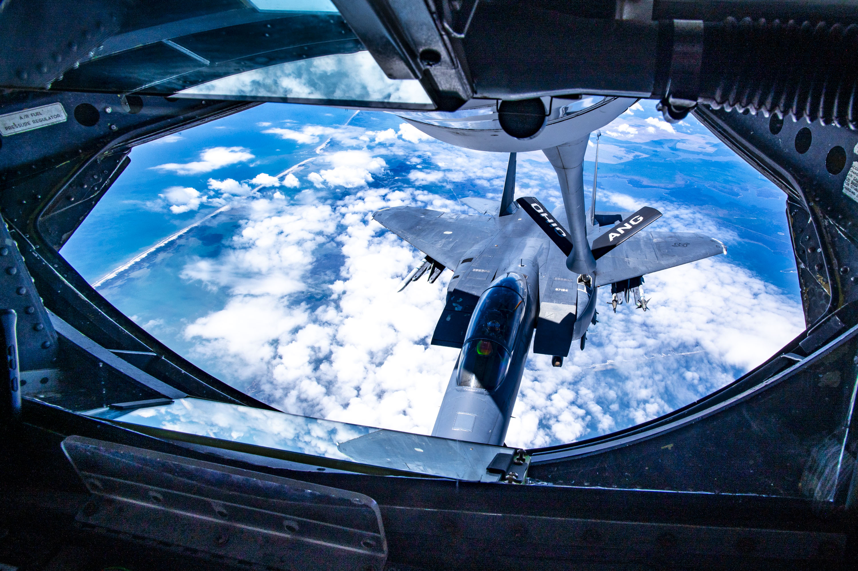 An F-15E Strike Eagle with the 4th Fighter Wing approaches a KC-135 Stratotanker from the 121st Air Refueling Wing to be refueled over the skies of North Carolina, May 7, 2024. The F-15E is a dual-role fighter designed to perform air-to-air and air-to-ground missions with an array of avionics and electronics systems that give it the capability to fight at low altitudes, day or night, and in all weather. (U.S. Air National Guard photo by Senior Airman Ivy Thomas)