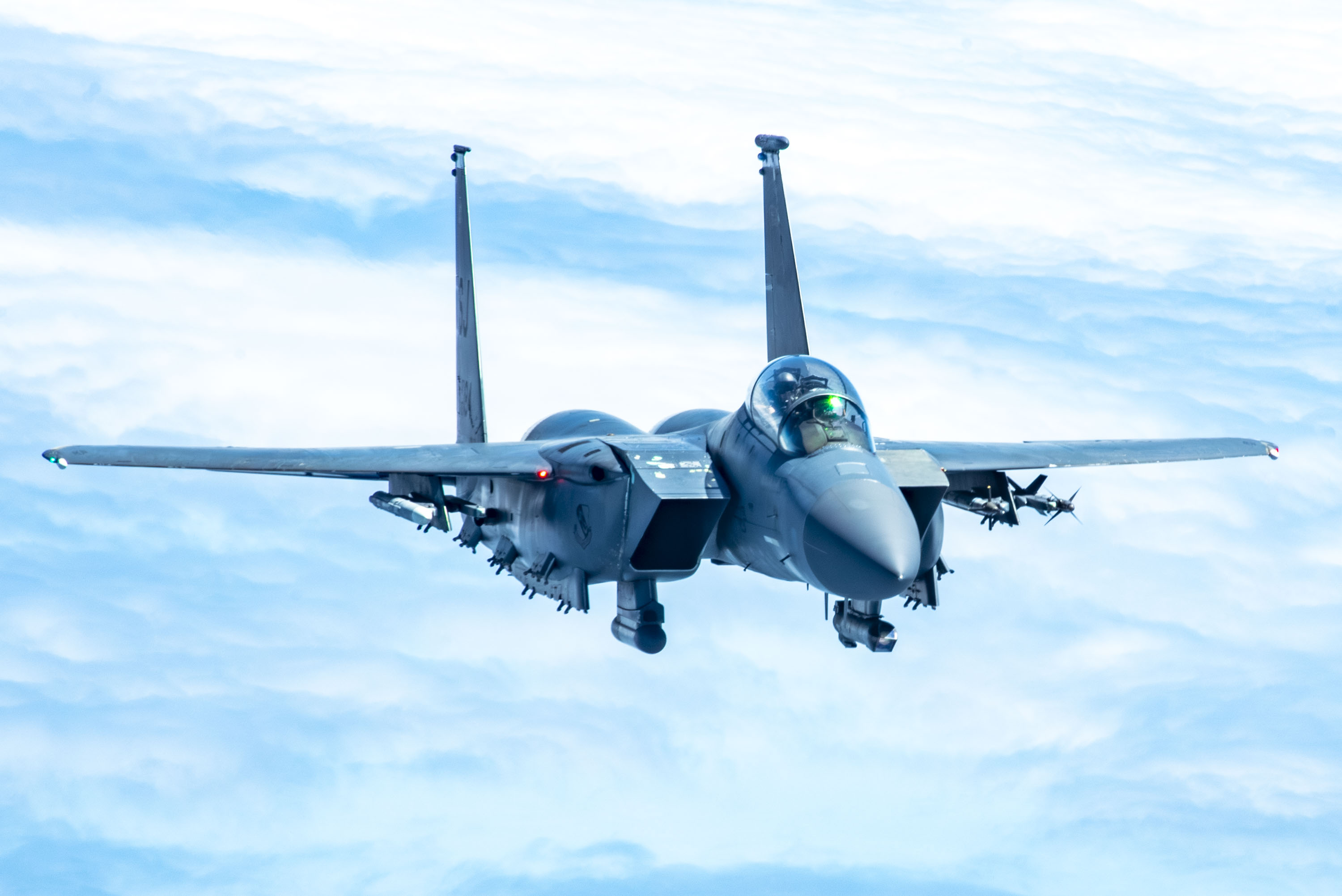 An F-15E Strike Eagle with the 4th Fighter Wing approaches a KC-135 Stratotanker from the 121st Air Refueling Wing to be refueled over the skies of North Carolina, May 7, 2024. The F-15E is a dual-role fighter designed to perform air-to-air and air-to-ground missions with an array of avionics and electronics systems that give it the capability to fight at low altitudes, day or night, and in all weather. (U.S. Air National Guard photo by Senior Airman Ivy Thomas)