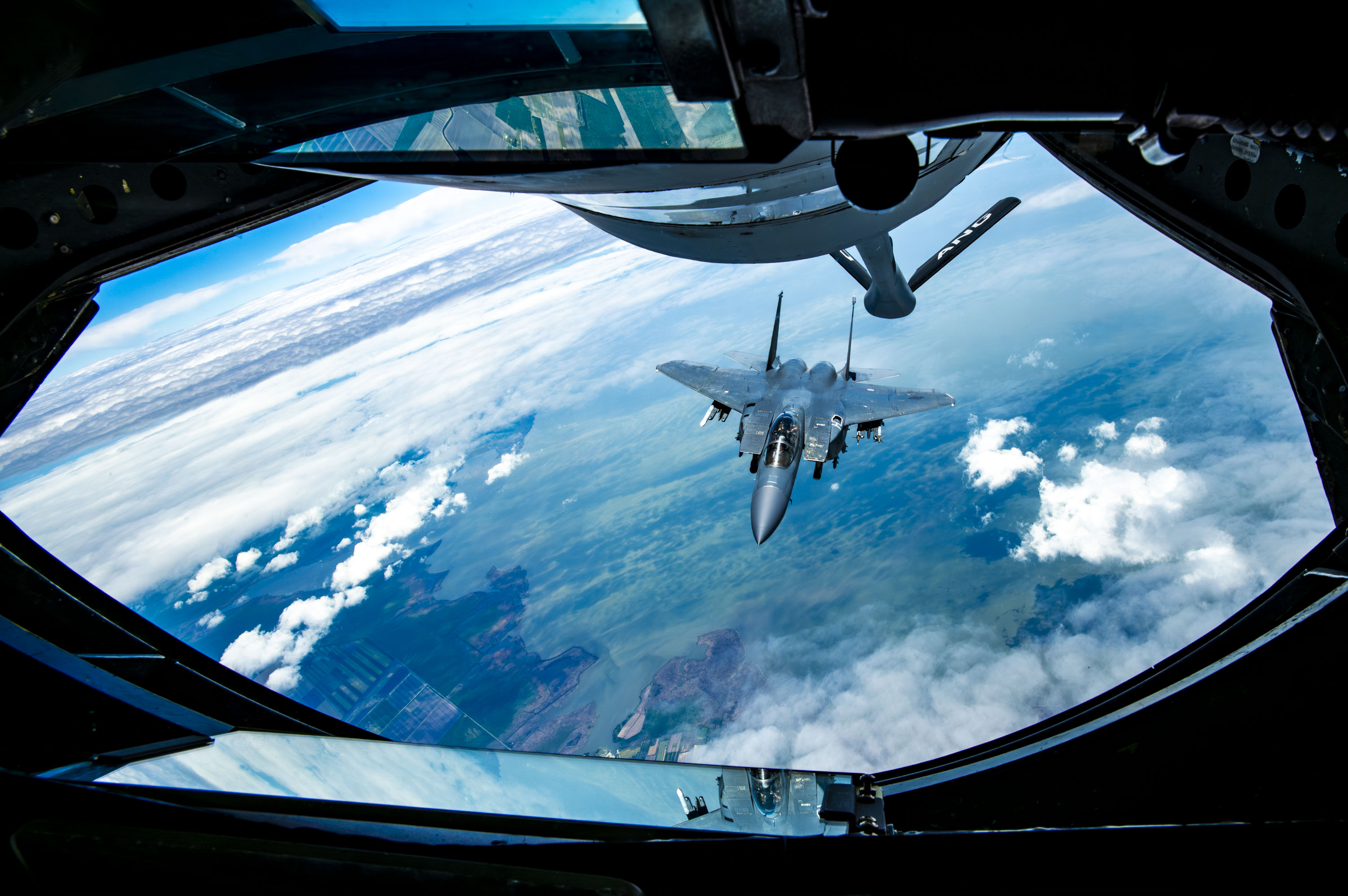 An F-15E Strike Eagle with the 4th Fighter Wing approaches a KC-135 Stratotanker from the 121st Air Refueling Wing to be refueled over the skies of North Carolina, May 7, 2024. The F-15E is a dual-role fighter designed to perform air-to-air and air-to-ground missions with an array of avionics and electronics systems that give it the capability to fight at low altitudes, day or night, and in all weather. (U.S. Air National Guard photo by Senior Airman Ivy Thomas)