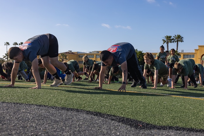 Participants in the Play60 Junior Chargers Training Camp conduct drills at Marine Corps Recruit Depot San Diego, California, April 19, 2024. The camp taught individuals aged 7-14 years old the fundamentals of football by running them through training drills. (U.S. Marine Corps photo by Lance Cpl. Jacob B. Hutchinson)
