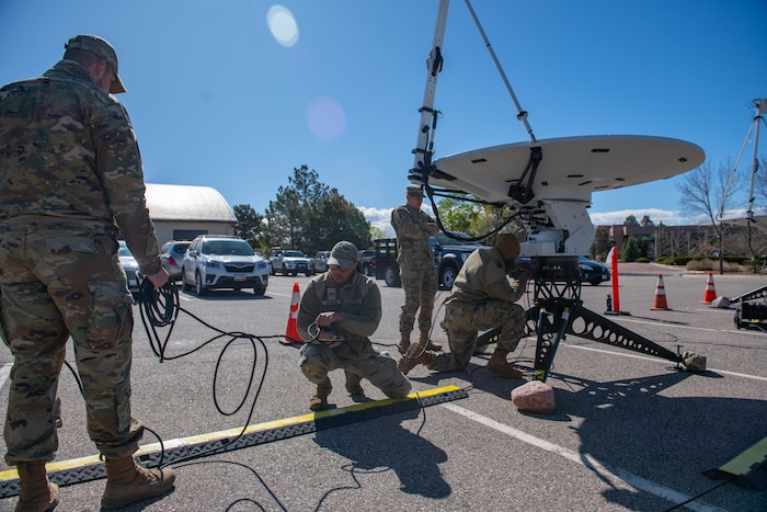 Guardians setting up antennas and equipment during a readiness exercise.