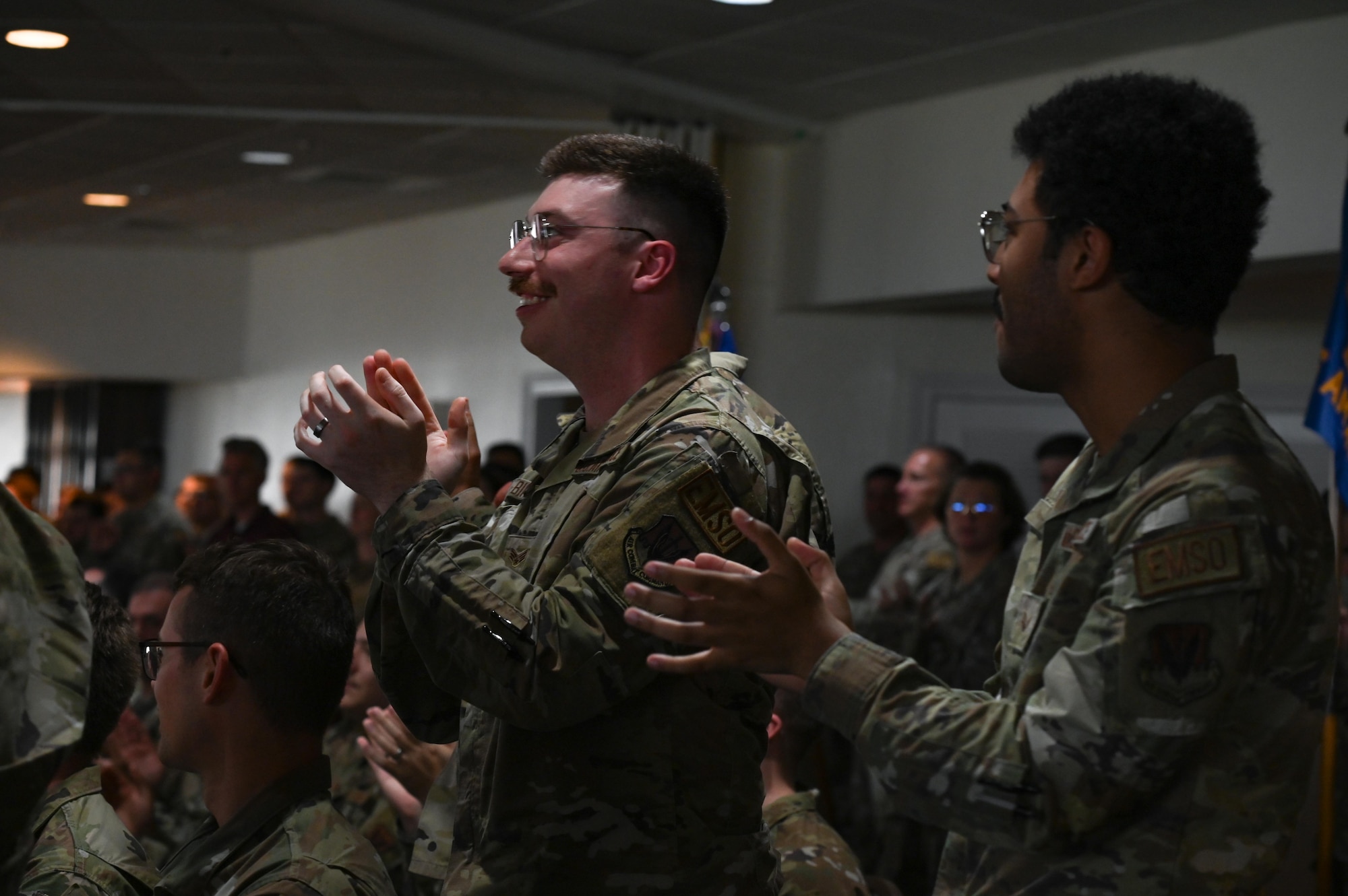 Members from the 350th Spectrum Warfare Wing applaud wing members for their graduation at the Eglin Airmen Leadership School graduation at Eglin Air Force Base, Florida, May 9, 2024. Four members from the 350th SWW were in the graduating class and the wing served as the host wing for the class, providing senior leader engagements for students. (U.S. Air Force photo by Capt. Benjamin Aronson)