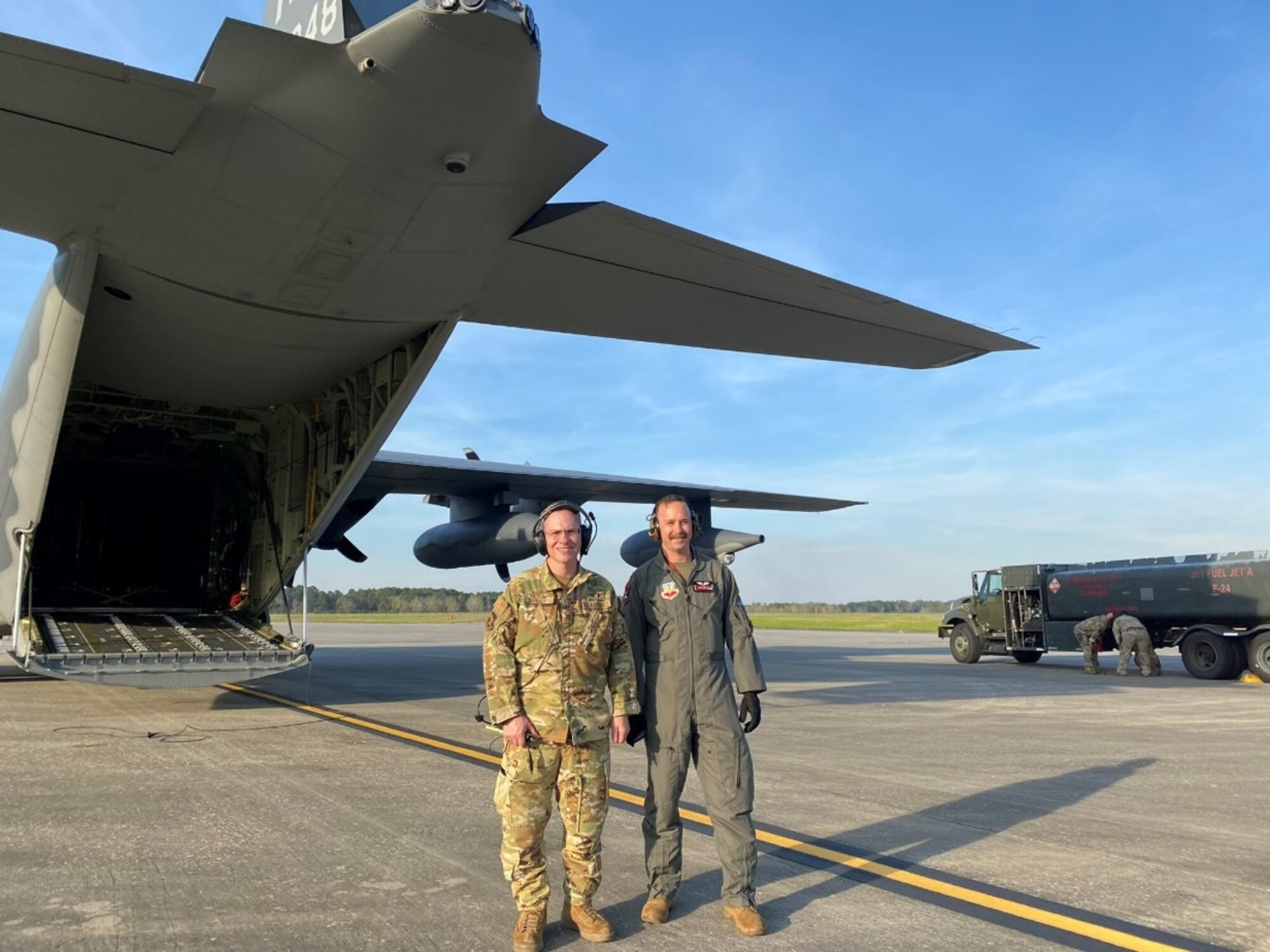 U.S. Air Force Maj. Jeremy Berger, 23rd Medical Group chief of aerospace medicine and Capt. Ronald Brady, flight surgeon 75th Fighter Squadron, pose for a photo after a flight at Moody Air Force Base, Georgia, Mar. 14, 2024. As flight surgeons Berger and Brady sometimes observe and monitor fire safety procedures during refueling of HC-130J Combat King IIs. (Courtesy photo by U.S. Air Force Major Jeremy Berger)