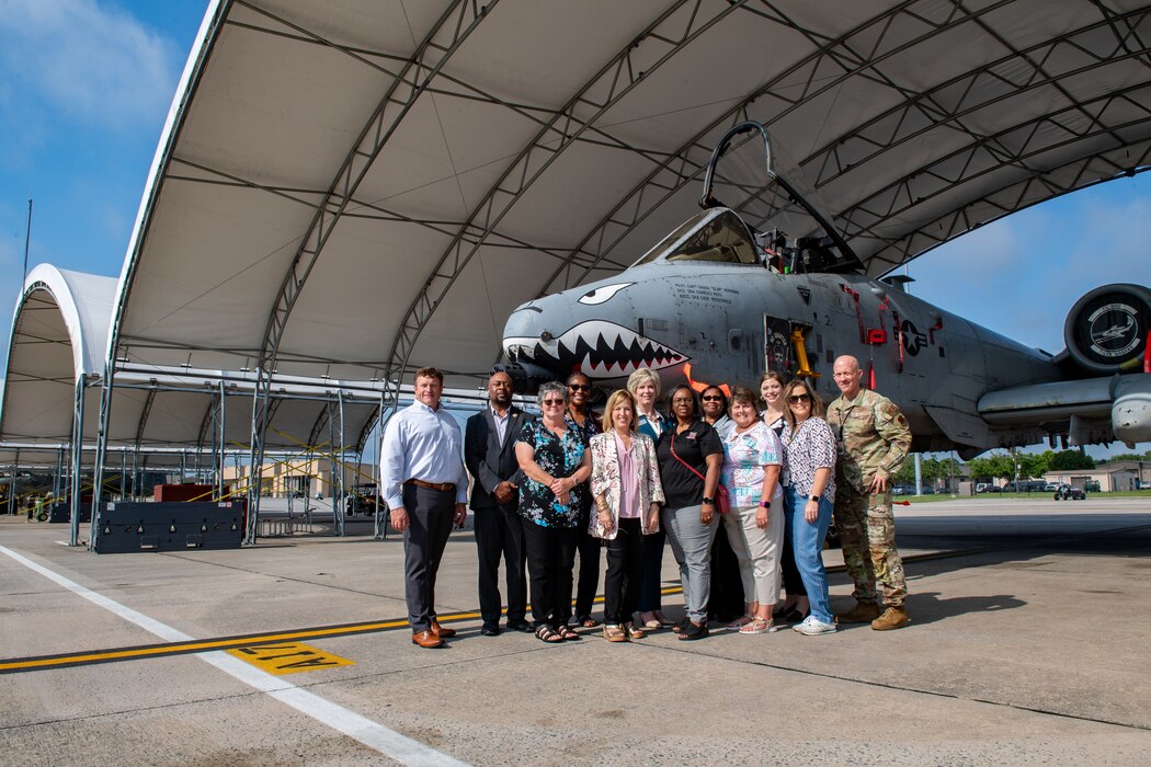 Members of the Moody School Board Liaison Committee pose for a photo during a base tour at Moody Air Force Base, Georgia, May 9, 2024. The MSBLC acts as a partnership between base leadership and local school superintendents to support school-age children and their families. (U.S. Air Force Photo by Senior Airman Courtney Sebastianelli)