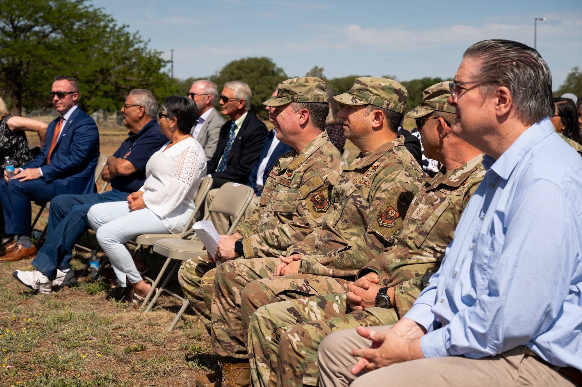 Cannon Air Force Base wing leadership sit in the audience alongside Cannon community partners during the Eastern New Mexico Sentinel Landscape designation announcement, May 15, 2024, here. The Eastern New Mexico Sentinel Landscape is one of five new landscapes designated by the Sentinel Landscapes Partnership, a coalition comprised of the U.S. Department of Agriculture (USDA), Department of Defense (DOD), and Department of the Interior (DOI), in 2024. (U.S. Air Force photo by Staff Sgt. Nicholas Swift)