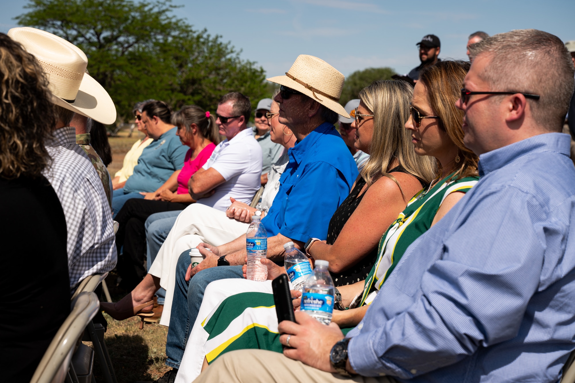Community members from Curry and Roosevelt counties listen as an announcement is made designating 2.4 million acres of land around Cannon Air Force Base as the Eastern New Mexico Sentinel Landscape, May 15, 2024, here. The announcement officially marked a milestone, designating 2.4 million acres of eastern New Mexico as a sentinel landscape. Sentinel Landscapes are areas where conservation, working lands, and national defense interests converge and are anchored by at least one high-value military installation or range. (U.S. Air Force photo by Staff Sgt. Nicholas Swift)