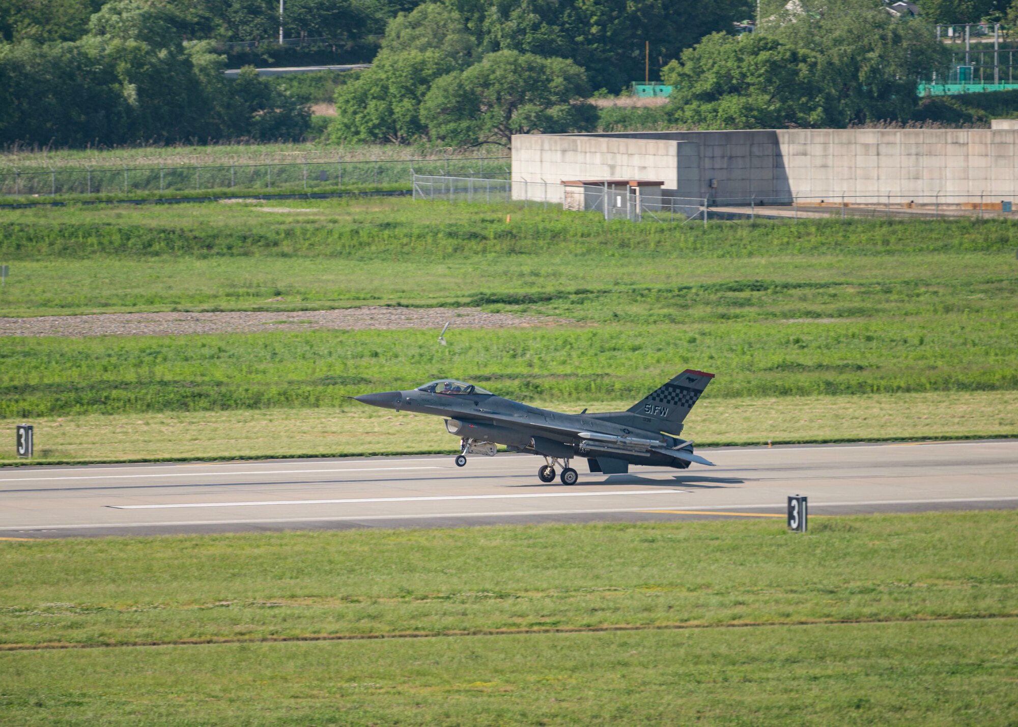 A U.S. Air Force F-16 Fighting Falcon assigned to the 36th Fighter Squadron lands on the flight line during Beverly Herd 24-1 at Osan Air Base, Republic of Korea, May 14, 2024. Team Osan provides ready to “Fight Tonight" air power, whenever and wherever needed. Routine training events like Beverly Herd are pivotal platforms for 51st Fighter Wing Airmen to refine their warfighting proficiencies through practical application, concurrently enhancing their ability to respond skillfully to contingencies. (U.S. Air Force Staff Sgt. Aubree Owens)