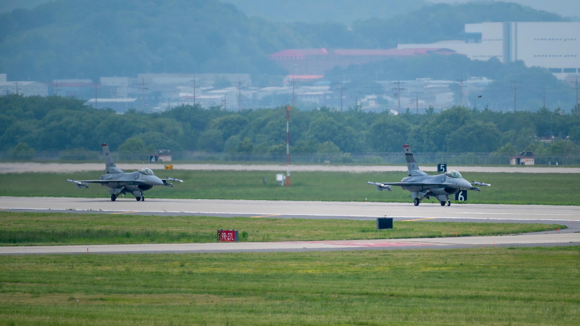 U.S. Air Force F-16 Fighting Falcons assigned to the 36th Fighter Squadron taxi on the flight line during Beverly Herd 24-1 at Osan Air Base, Republic of Korea, May 15, 2024. The 51st Fighter Wing executes the mission by maintaining and training aircrew members on high-paced flight line operations. Routine training events like Beverly Herd, are pivotal platforms for 51st Fighter Wing Airmen to refine their warfighting proficiencies through practical application, concurrently enhancing their ability to respond skillfully to contingencies. (U.S. Air Force photo by Senior Airman Sabrina Fuller-Judd)