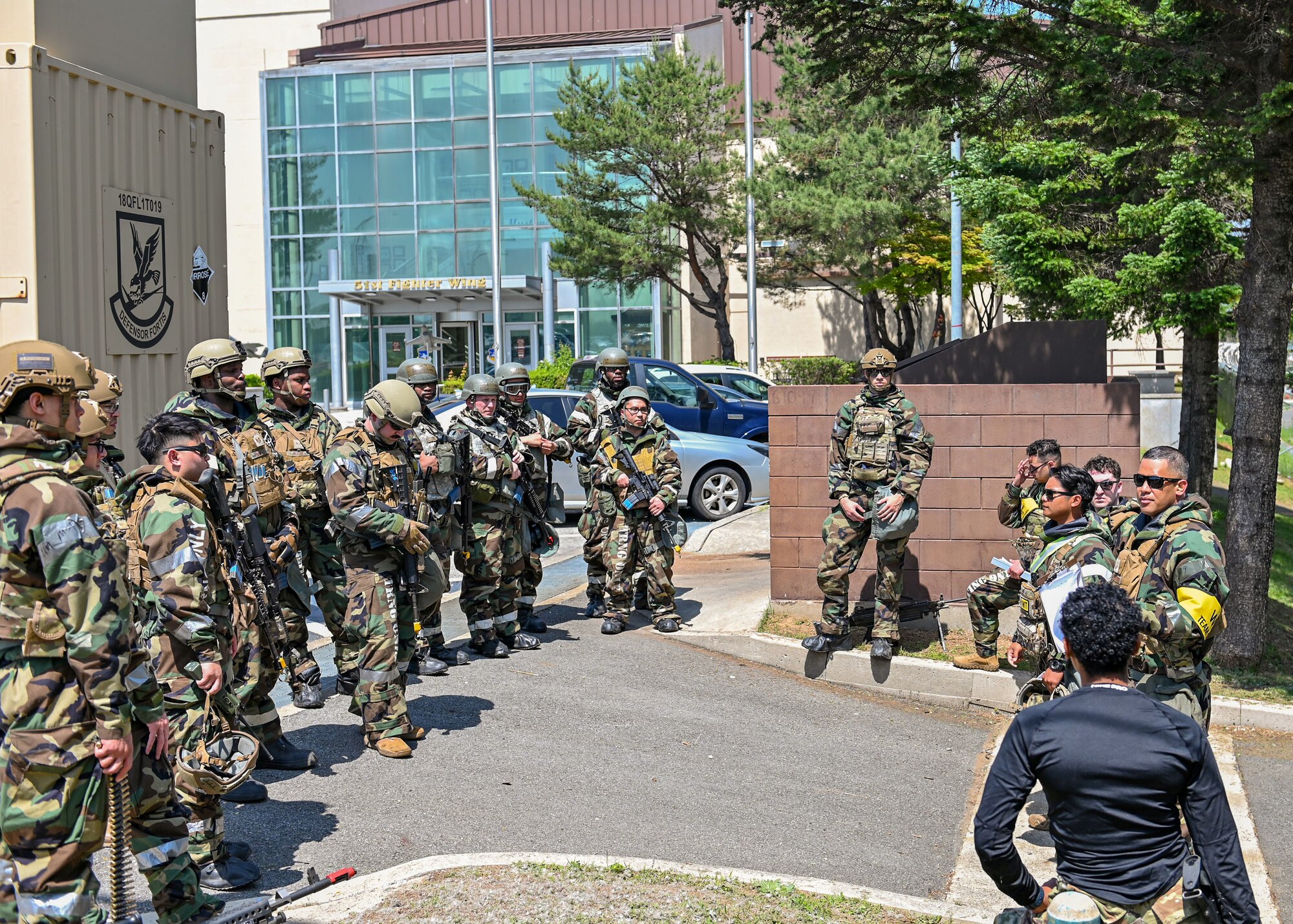 Members of 51st Security Forces Squadron conduct an after-action brief following ground attack training during Beverly Herd 24-1 at Osan Air Base, Republic of Korea, May 13, 2024. The Airmen of the 51st Fighter Wing continuously train to maintain the high level of full spectrum readiness required to execute the mission proficiently and effectively. During BH 24-1, base personnel demonstrated their ability to navigate various attack scenarios while launching and recovering aircraft during 24-hour flying operations, validating the 51st Fighter Wing’s readiness and response against any adversary. (U.S. Air Force photo by Staff Sgt. Aubree Owens)