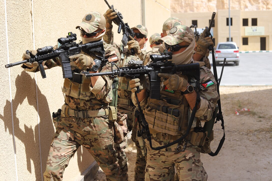 Jordanian Special Operations Forces conduct close quarters battle drills during Eager Lion 24 at King Abdullah II Operations Training Center, Jordan, May 12, 2024. Eager Lion 24 is a multilateral exercise, with 33 participating nations, hosted by the Hashemite Kingdom of Jordan, designed to exchange military expertise, and improve interoperability among partner nations, and considered the capstone of a broader U.S. military relationship with the Jordanian Armed Forces. Jordan is one of U.S. Central Command’s strongest and most reliable partners in the Levant sub-region. (U.S. Army photo by Staff Sgt. Brandon White.)