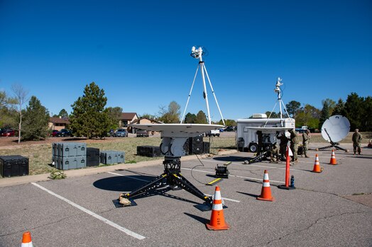  Image of multiple antennas and equipment set up by Guardians during a field training exercise.