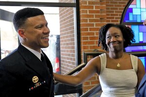 Commander and wife standing