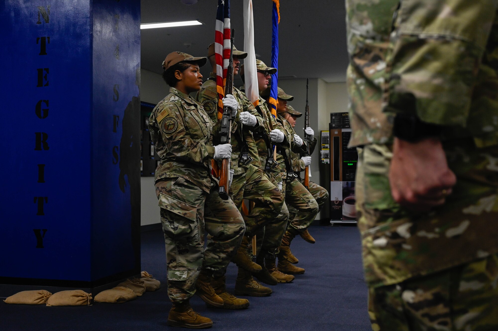 A group of Airmen march in place.
