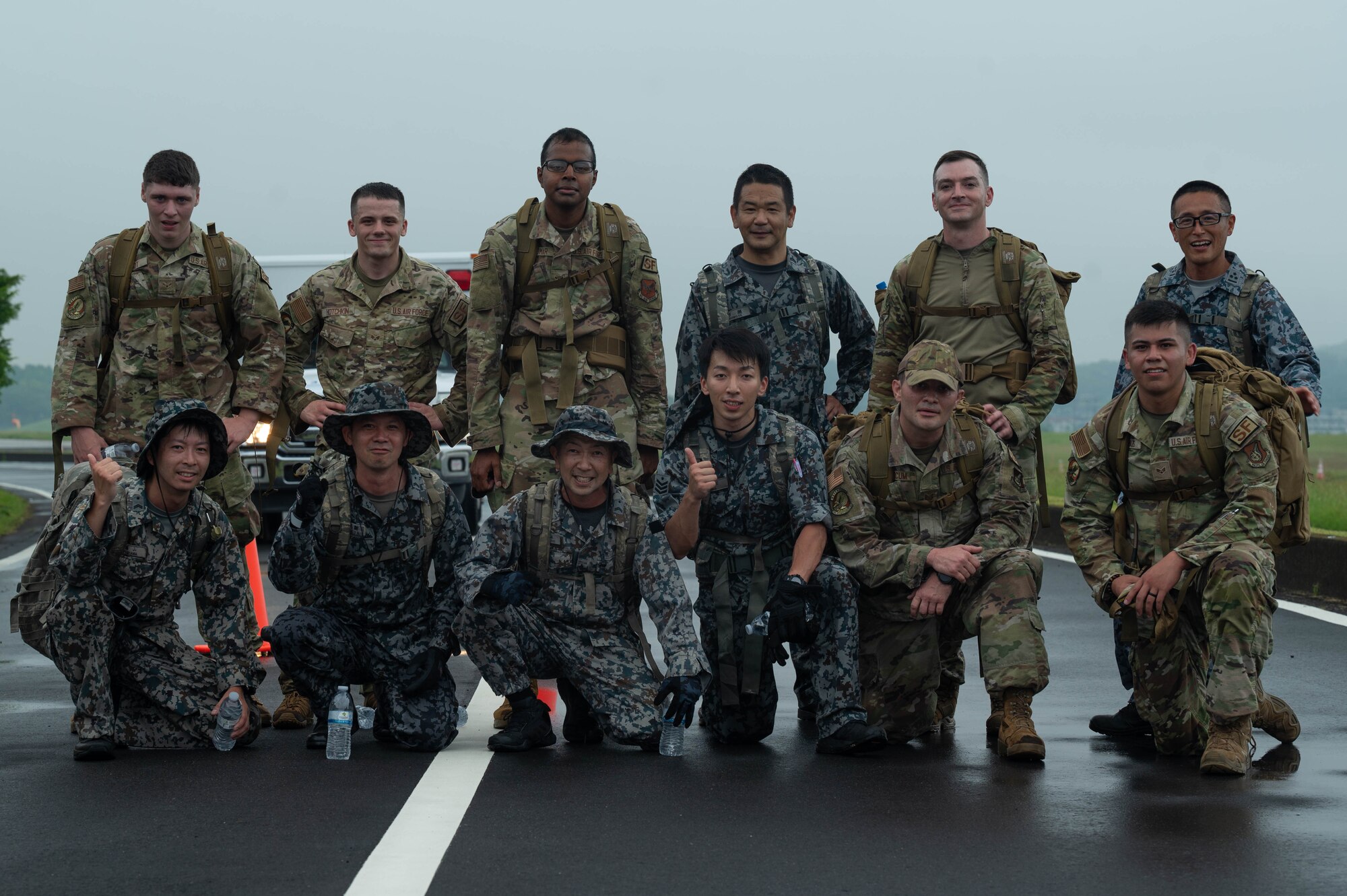 Military service members pose for a photo.