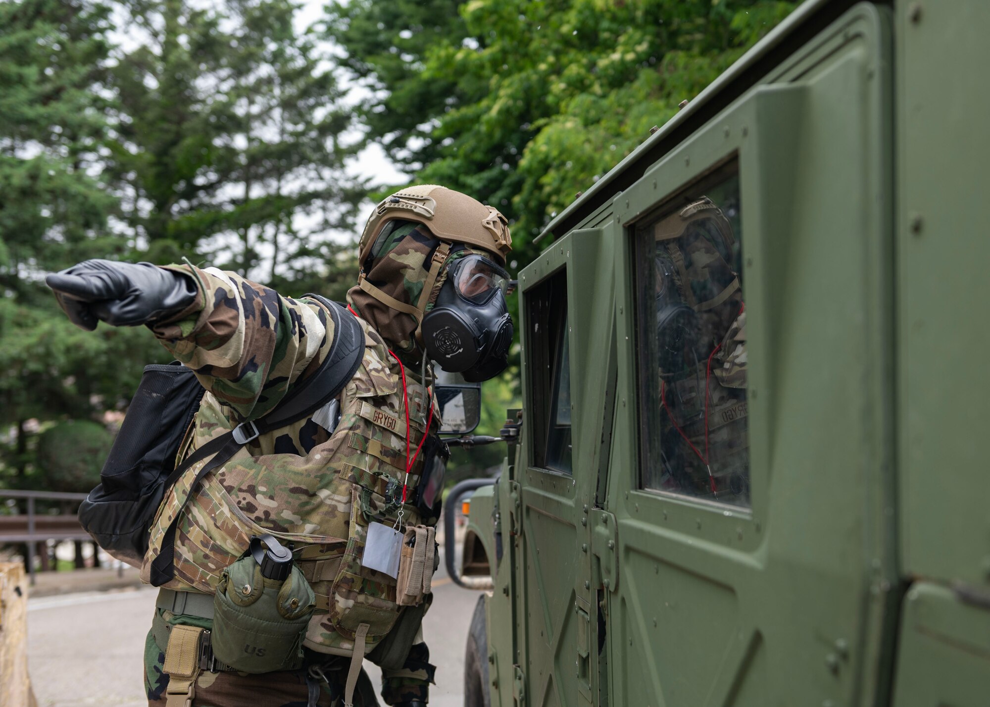 U.S. Air Force Col. Kyle Grygo, 51st Mission Support Group commander, directs 51st Security Forces Squadron Defenders in a “bug out” training event during Beverly Herd 24-1 at Osan Air Base, Republic of Korea, May 15, 2024. During BH 24-1, base personnel demonstrated their ability to navigate various attack scenarios while launching and recovering aircraft during 24-hour flying operations, validating the 51st Fighter Wing’s readiness and response against any adversary. Training is conducted throughout the year to generate combat airpower at a moment’s notice, affirming the commitment to the Republic of Korea remains ironclad and ensures regional stability throughout the U.S. Indo-Pacific Command. (U.S. Air Force photo by Staff Sgt. Aubree Owens)