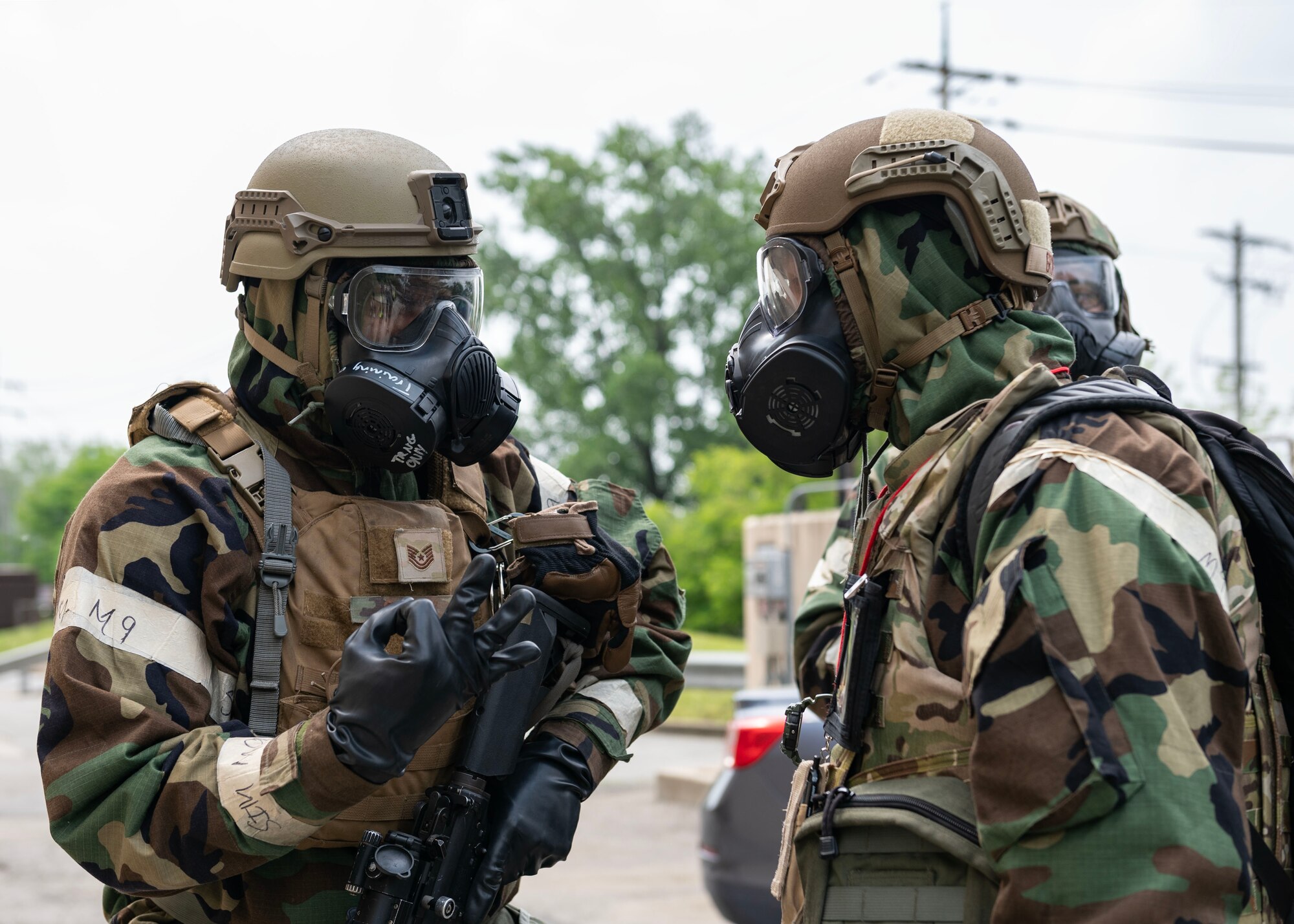U.S. Air Force Col. Kyle Grygo, left, 51st Mission Support Group commander, speaks to Tech. Sgt. Edrick Coley, 51st Security Forces Squadron mission assurance section chief, in a “bug out” training event while in mission-oriented protective posture level four during Beverly Herd 24-1 at Osan Air Base, Republic of Korea, May 15, 2024. The Airmen of the 51st Fighter Wing continuously train to maintain the high level of full-spectrum readiness required to execute the mission proficiently and effectively. Routine training events like Beverly Herd are pivotal platforms for 51st Fighter Wing Airmen to refine their warfighting proficiencies through practical application, concurrently enhancing their ability to respond skillfully to contingencies. (U.S. Air Force photo by Staff Sgt. Aubree Owens)
