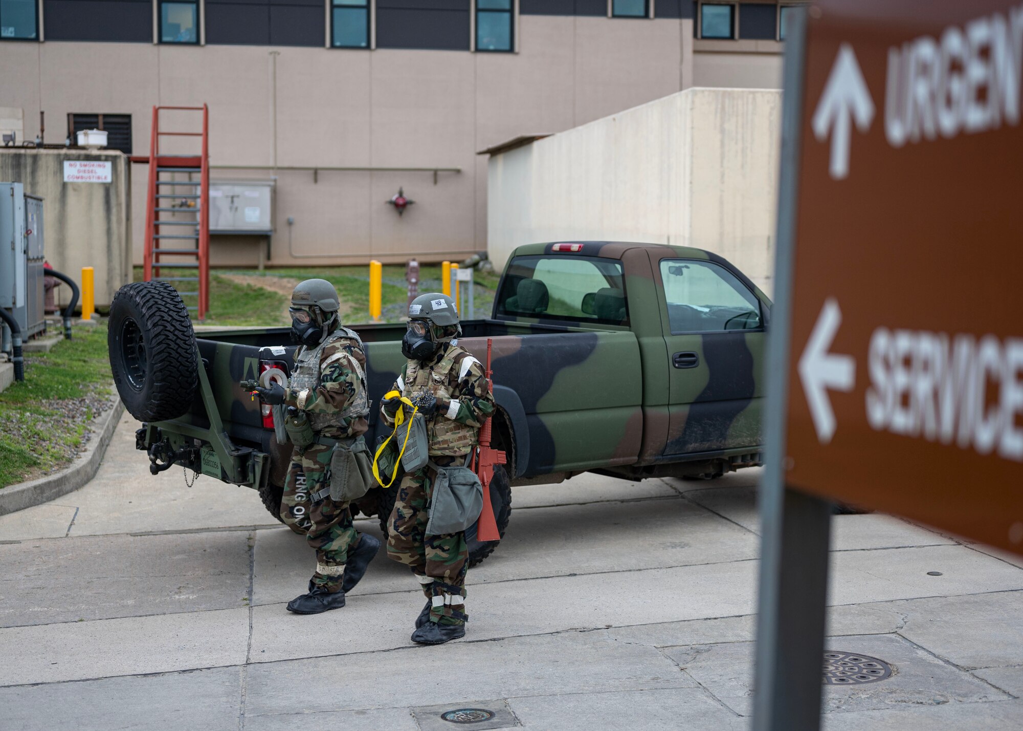 U.S. Air Force Senior Airman Joseph Bulik, left, 51st Fighter Wing emergency maintenance services team augmentee, and Airman 1st Class Veronyca Ortiz, 51st FW EMST augmentee, prepare to cordon an inert ordnance near the 51st Medical Group in a training event during Beverly Herd 24-1 at Osan Air Base, Republic of Korea, May 15, 2024. The augmentee program enforces multi-capable Airmen by enabling skills such as surveillance, defense postures and tactical combat casualty care to prepare for contingency operations. Training is conducted throughout the year to generate combat airpower at a moment’s notice, affirming the commitment to the Republic of Korea remains ironclad and ensures regional stability throughout the U.S. Indo-Pacific Command.  (U.S. Air Force photo by Staff Sgt. Aubree Owens)