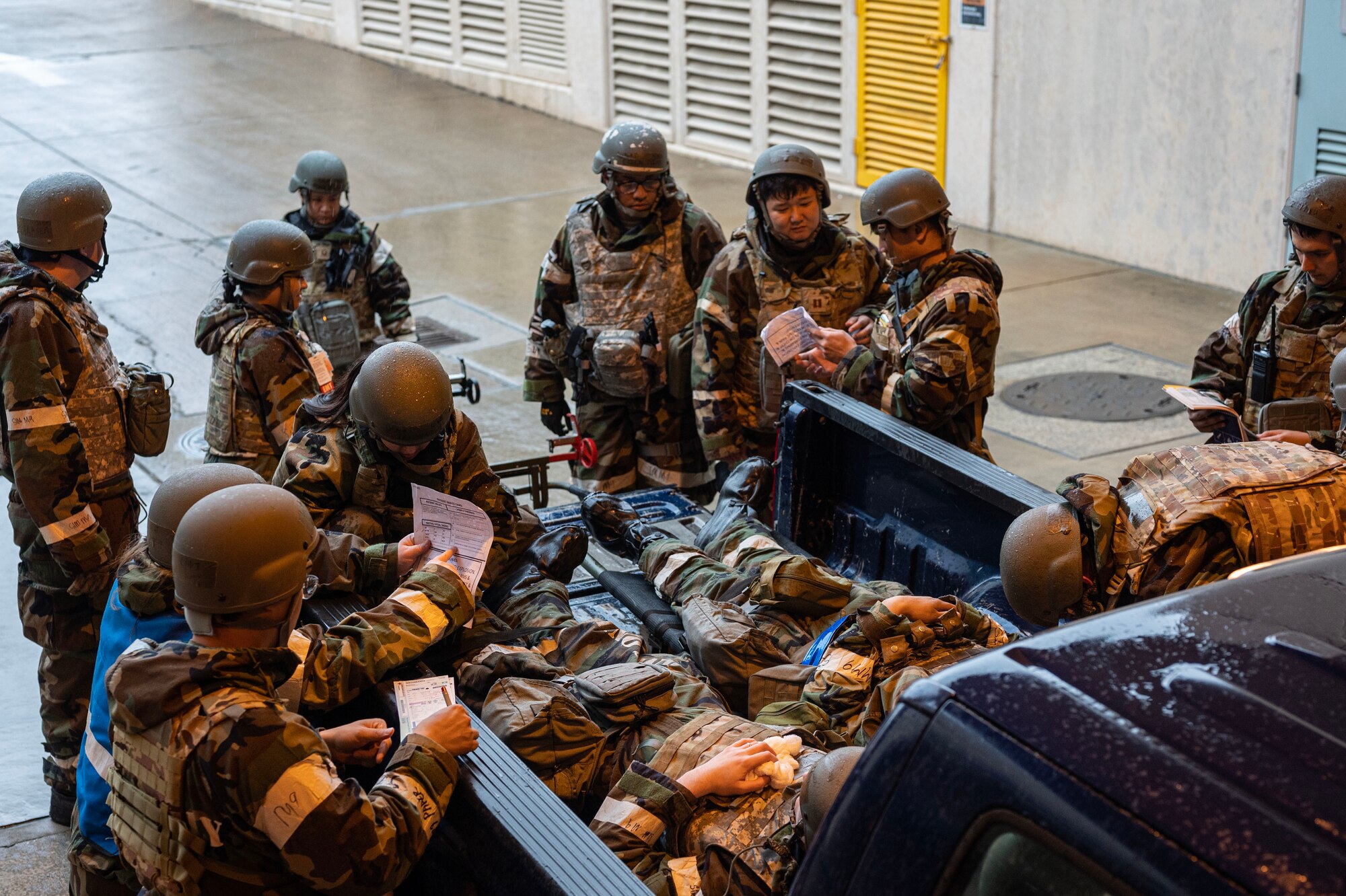 U.S. Air Force Airmen assigned to the 51st Medical Group intake simulated patients injured by an inert ordnance during Beverly Herd 24-1 at Osan Air Base, Republic of Korea, May 15, 2024. The wing executes military operations to bed-down, maintain and employ follow-on forces. Routine training events like Beverly Herd, are pivotal platforms for 51st Fighter Wing Airmen to refine their warfighting proficiencies through practical application, concurrently enhancing their ability to respond skillfully to contingencies. (U.S. Air Force photo by Staff Sgt. Aubree Owens)
