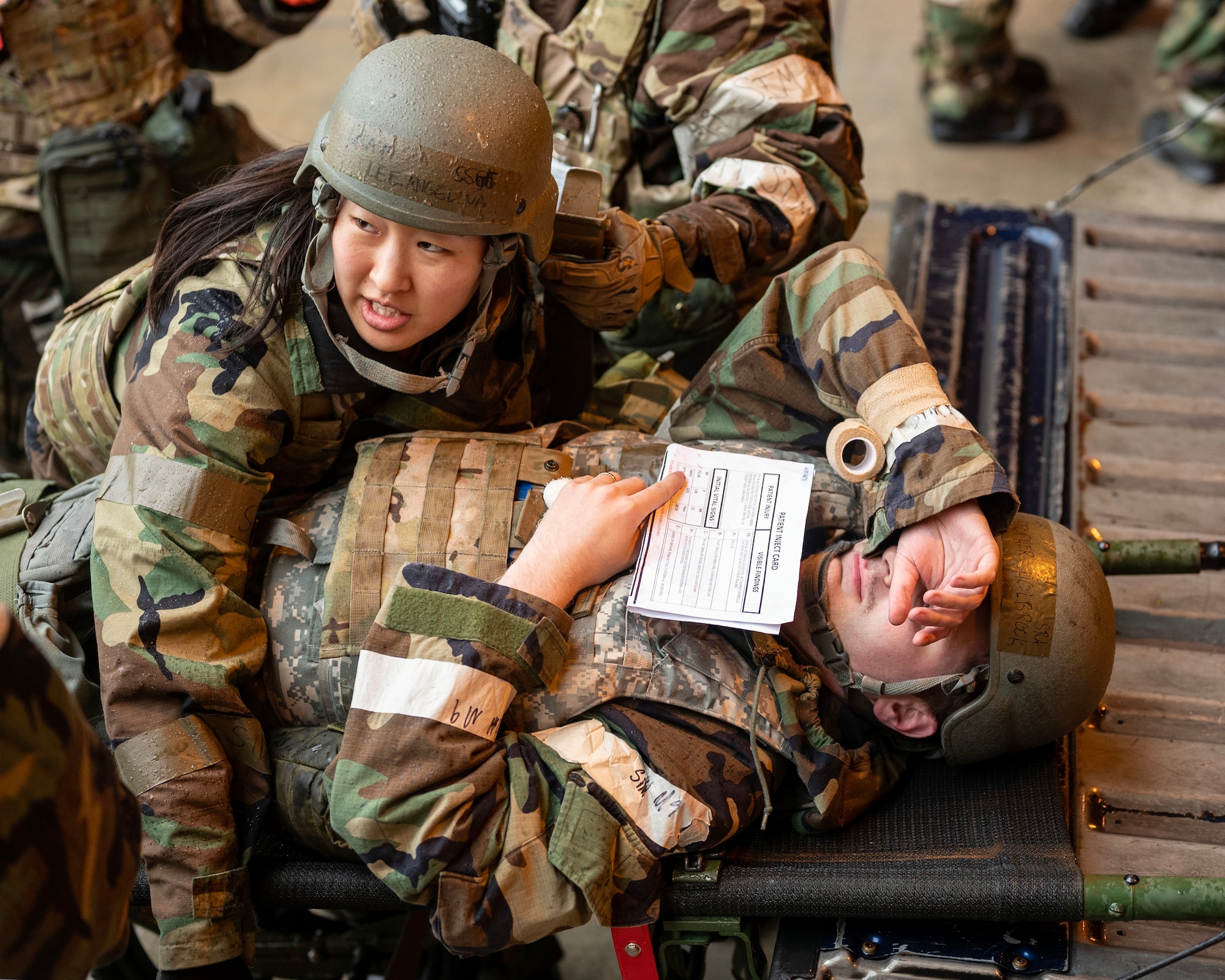 U.S. Air Force Staff Sgt. Angelina Lee, 51st Medical Group medical technician, straps a simulated injured patient to a stretcher in a training event during Beverly Herd 24-1 at Osan Air Base, Republic of Korea, May 15, 2024. The 51st MDG mission is to maximize the human weapon and execute medical care procedures to prepare for contingency operations. The Airmen of the 51st Fighter Wing strive to be multi-capable and adaptive problem solvers, aiming to be innovative and courageous, and demonstrate the value in diversity of thought, ingenuity, and initiative. (U.S. Air Force photo by Staff Sgt. Aubree Owens)