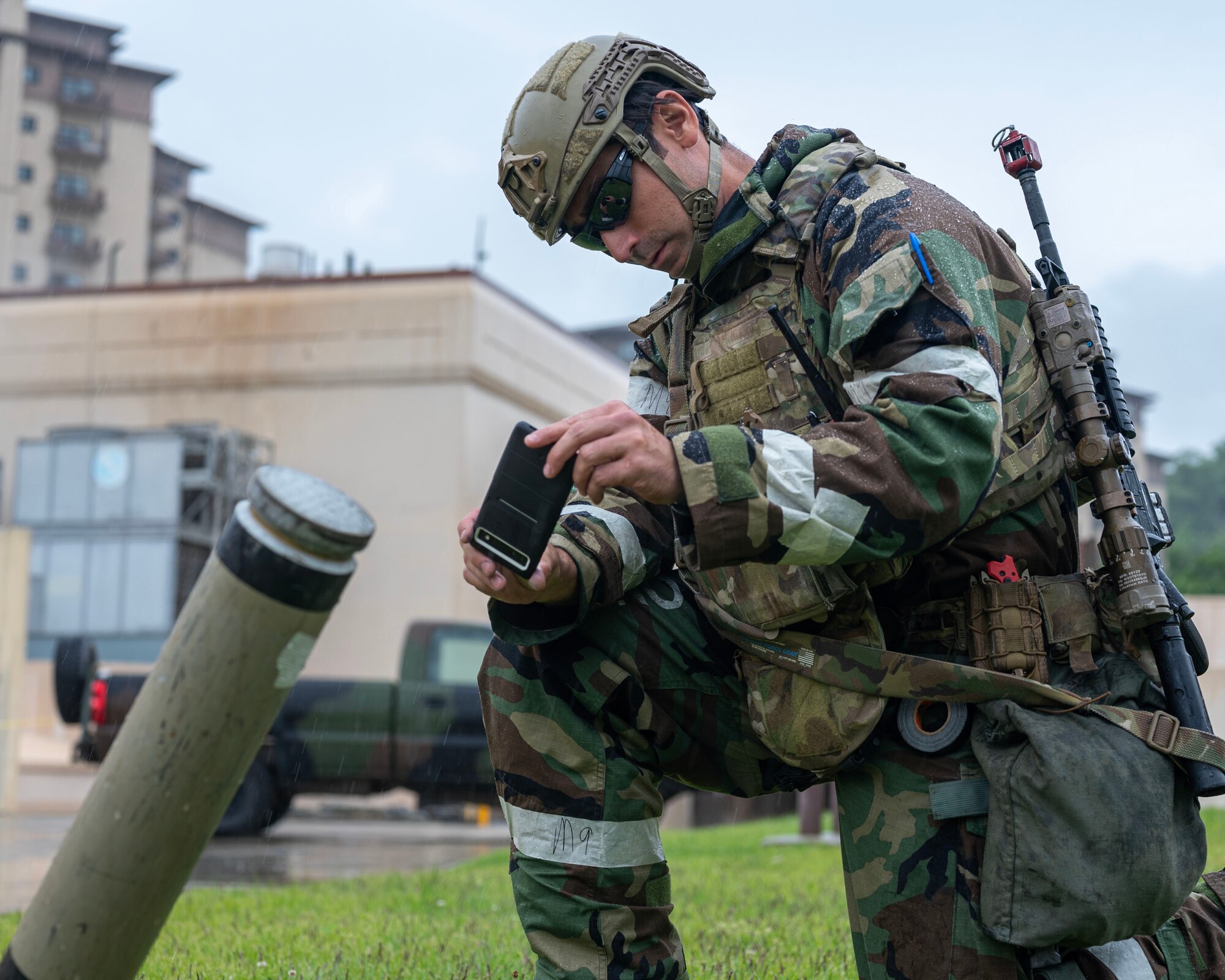 U.S. Air Force Tech. Sgt. Eric Jones, 51st Civil Engineer Squadron explosive ordnance disposal team leader, photographs an inert ordnance during a training event during Beverly Herd 24-1 at Osan Air Base, Republic of Korea, May 15, 2024. The 51st CES EOD team trained on improving force protection and responding to explosive emergencies. As the most forward deployed permanently based wing in the Air Force, the 51st Fighter Wing is charged with providing mission-ready Airmen to execute combat operations and receive follow-on forces. (U.S. Air Force photo by Staff Sgt. Aubree Owens)