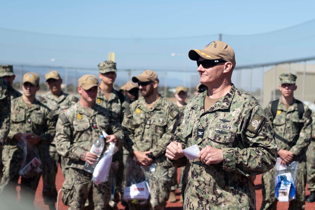 Capt. Odin J. Klug, commanding officer, Naval Support Activity Souda Bay, talks about summer safety hazards during a Summer Safety Stand Down event hosted by the NSA Souda Bay Safety Office at the base softball field on May 14, 2024.