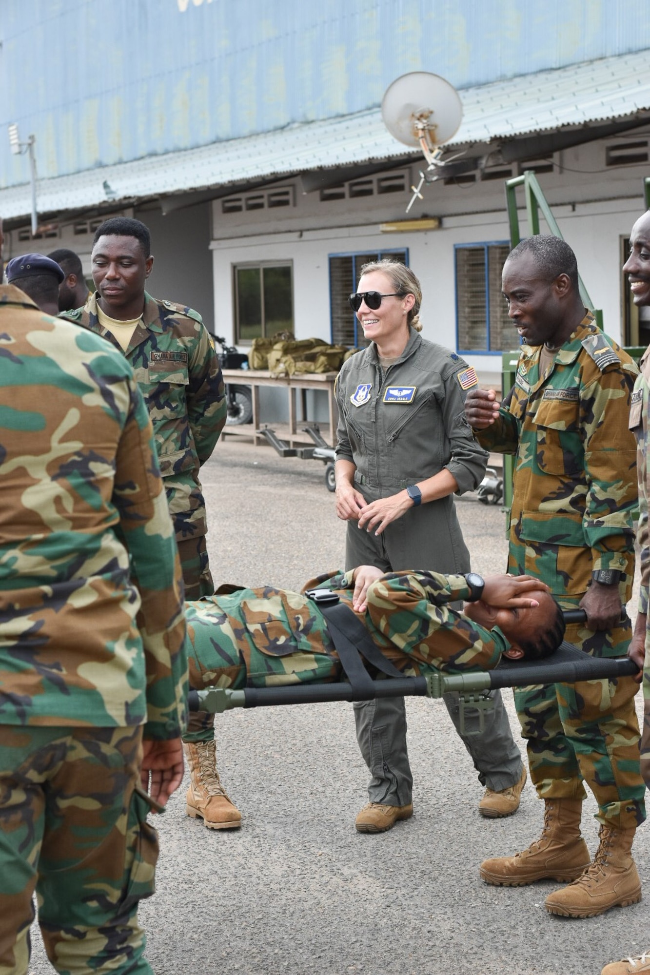 U.S. Air Force Lt. Col. Erika Seagle, an instructor with the U.S. Defense Institute for Medical Operations, advises as members of the Ghana Armed Forces practice litter carries during a training event in Accra, Ghana, in early May. The training was part of the GAF’s pursuit of United Nations validation of its Aeromedical Evacuation Team capabilities. (Courtesy photo)
