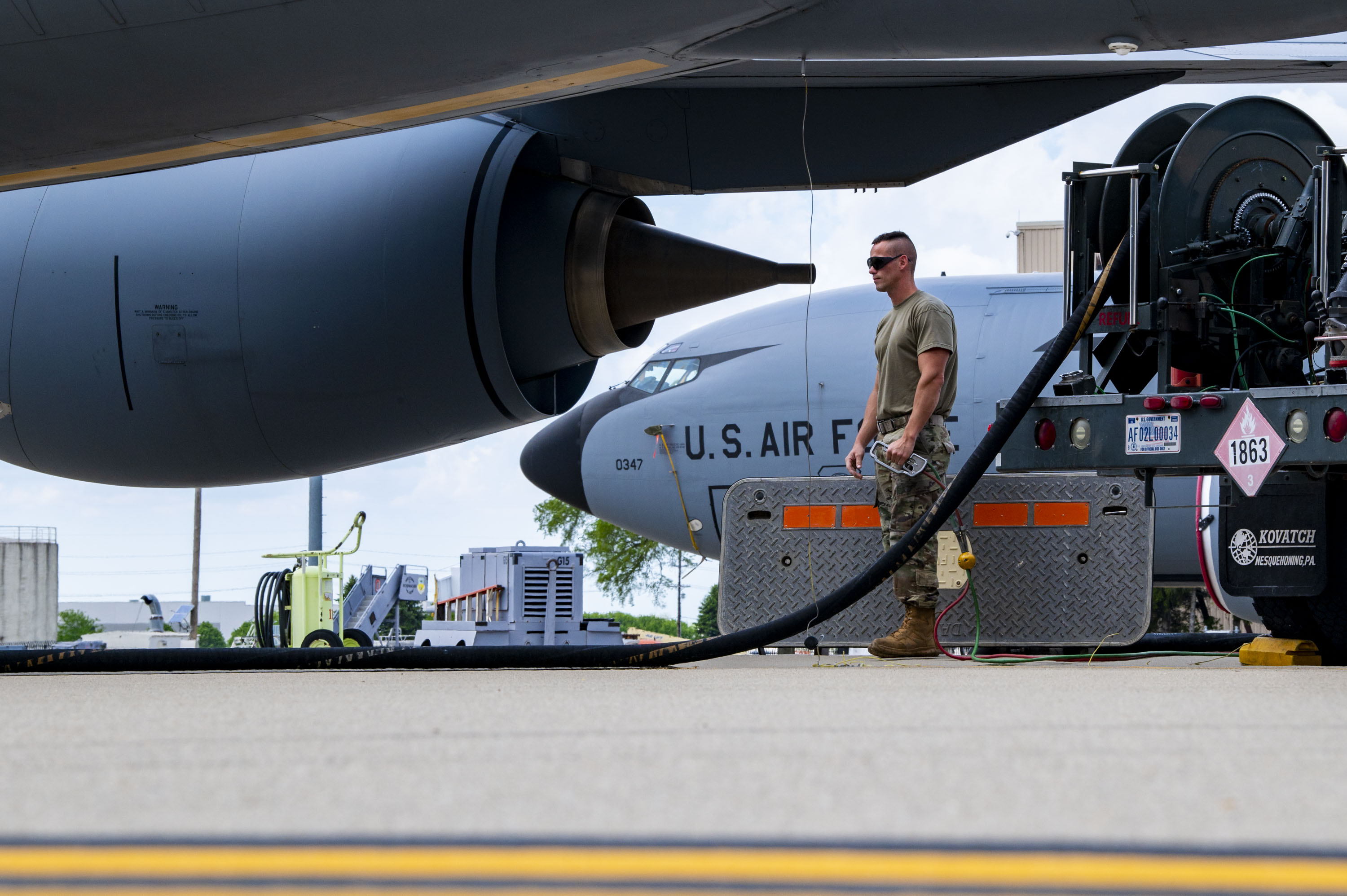 U.S. Air Force Tech. Sgt. Christopher Croxton, a petroleum, oils, and lubricant Airman with the 121st Air Refueling Wing, operates a fuel truck while refueling a KC-135 Stratotanker on the flight line at Rickenbacker Air National Guard Base, Columbus, Ohio, April 30, 2024. Before putting the fuel onto the KC-135 Stratotanker, POL tests fuel samples to ensure the fuel is free of contaminants and ready to be offloaded onto the jet, which is then used to accomplish aerial refueling. (U.S. Air National Guard photo by Senior Airman Ivy Thomas)