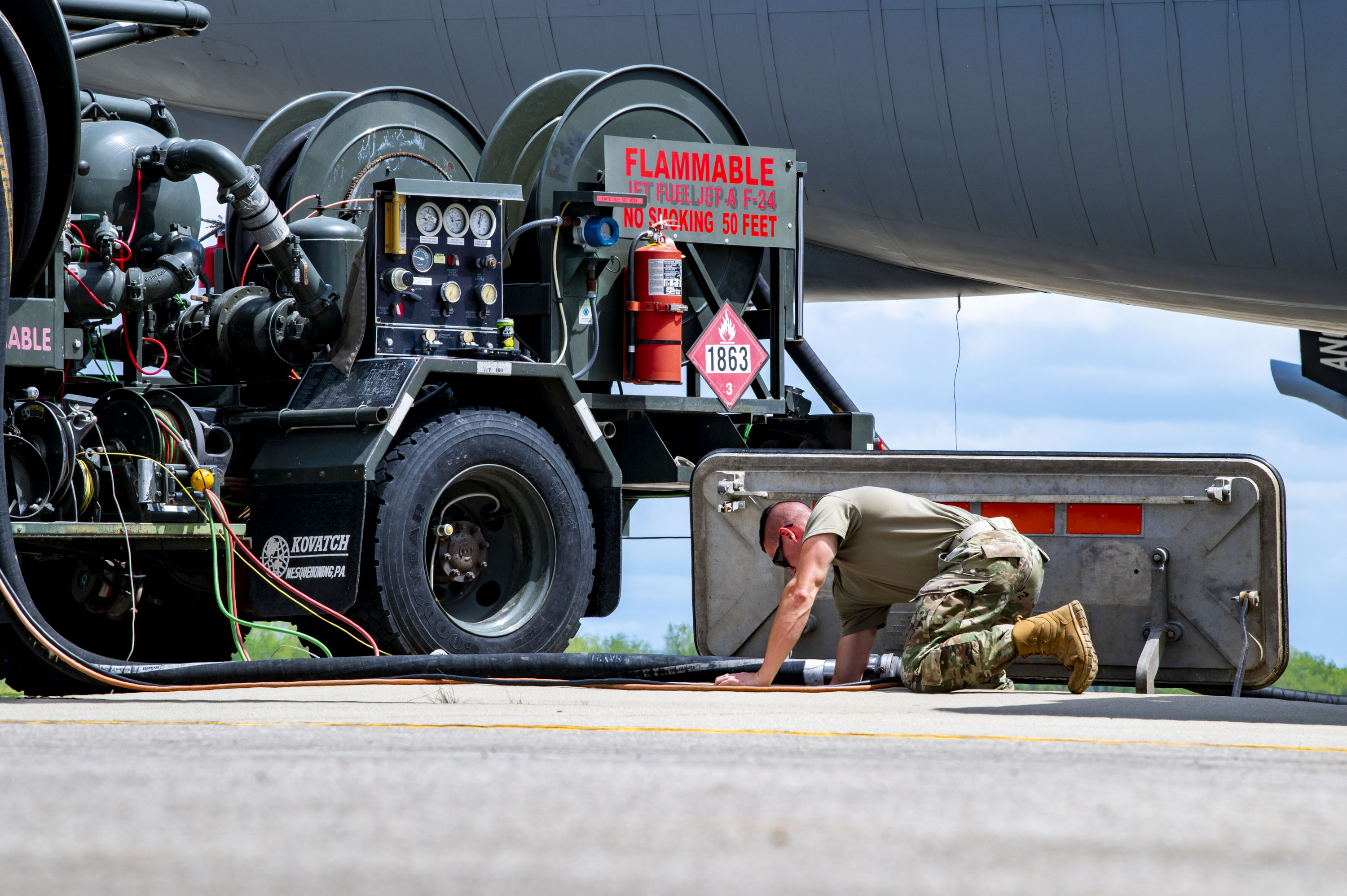 U.S. Air Force Tech. Sgt. Christopher Croxton, a petroleum, oils, and lubricant Airman with the 121st Air Refueling Wing, operates a fuel truck while refueling a KC-135 Stratotanker on the flight line at Rickenbacker Air National Guard Base, Columbus, Ohio, April 30, 2024. Before putting the fuel onto the KC-135 Stratotanker, POL tests fuel samples to ensure the fuel is free of contaminants and ready to be offloaded onto the jet, which is then used to accomplish aerial refueling. (U.S. Air National Guard photo by Senior Airman Ivy Thomas)