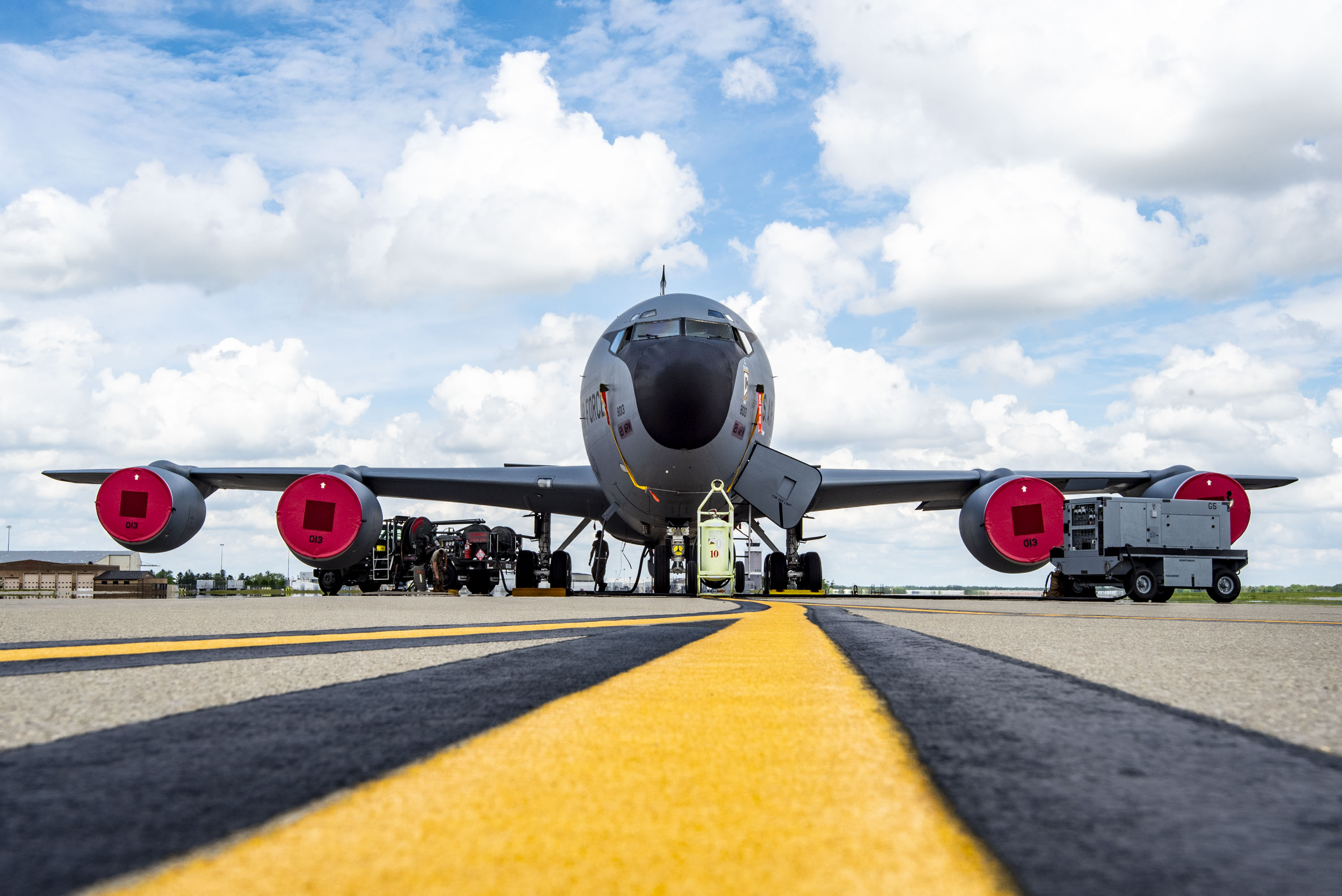 A KC-135 Stratotanker sits on the flight line while being refueled by a petroleum, oils, and lubricant Airman from the 121st Air Refueling Wing at Rickenbacker Air National Guard Base, Columbus, Ohio, April 30, 2024. Before putting the fuel onto the KC-135 Stratotanker, POL tests fuel samples to ensure the fuel is free of contaminants and ready to be offloaded onto the jet, which is then used to accomplish aerial refueling missions. (U.S. Air National Guard photo by Senior Airman Ivy Thomas)
