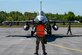 U.S Air Force Airman 1st Class Christopher Bethany, 555th Fighter Generation Squadron weapons load crew member, marshals an F-16 Fighting Falcons to conduct a hot pit during Exercise Astral Knight 24 at Šiauliai Air Base, Lithuania, May 14, 2024. AK24 is the U.S. European Command’s capstone of an integrated air and missile defense exercise focused on incremental development of theater-wide allied IAMD architecture. (U.S. Air Force photo by Airman 1st Class Zachary Jakel)