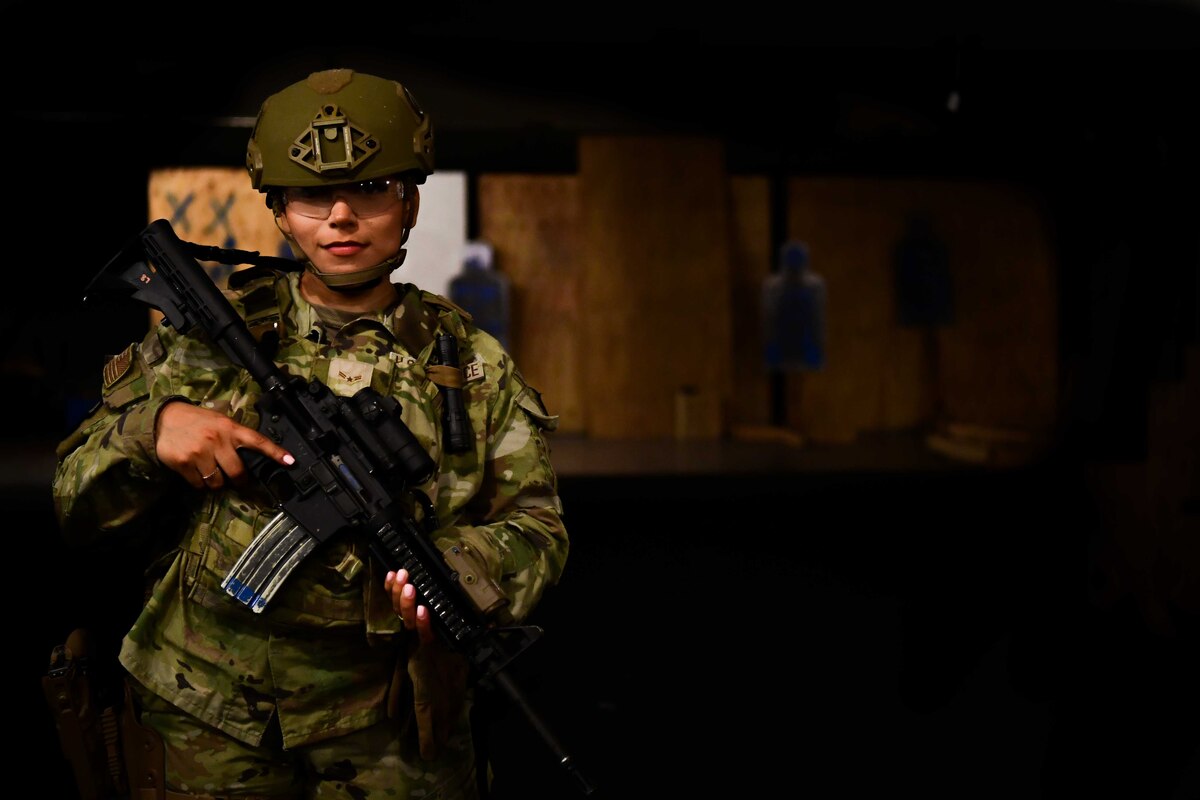 A security forces airman poses for a photo