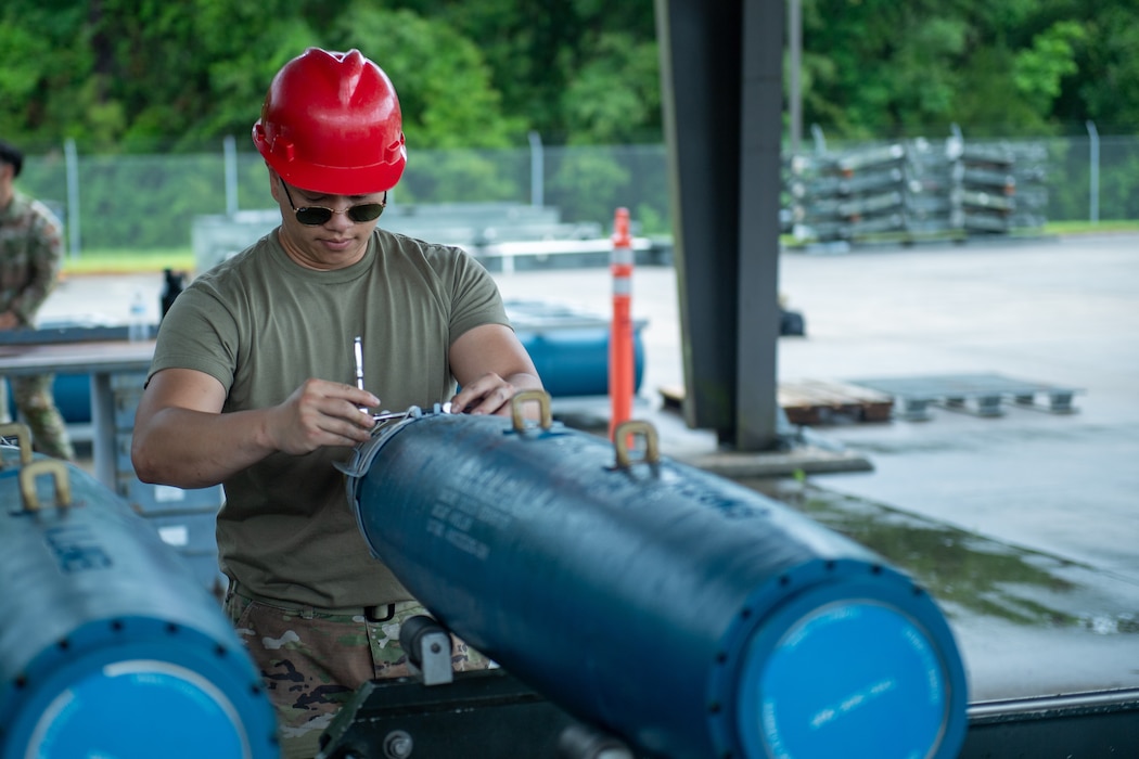 An Airman from the 23rd Munitions Squadron assembles ammunition at Moody Air Force Base, Georgia, May 14, 2024. During the combat munitions training class, three different types of explosives were assembled: the GBU 31 V1, the GBU 12, and the GBU 38. (U.S. Air Force photo by Airman 1st Class Cade Ellis)