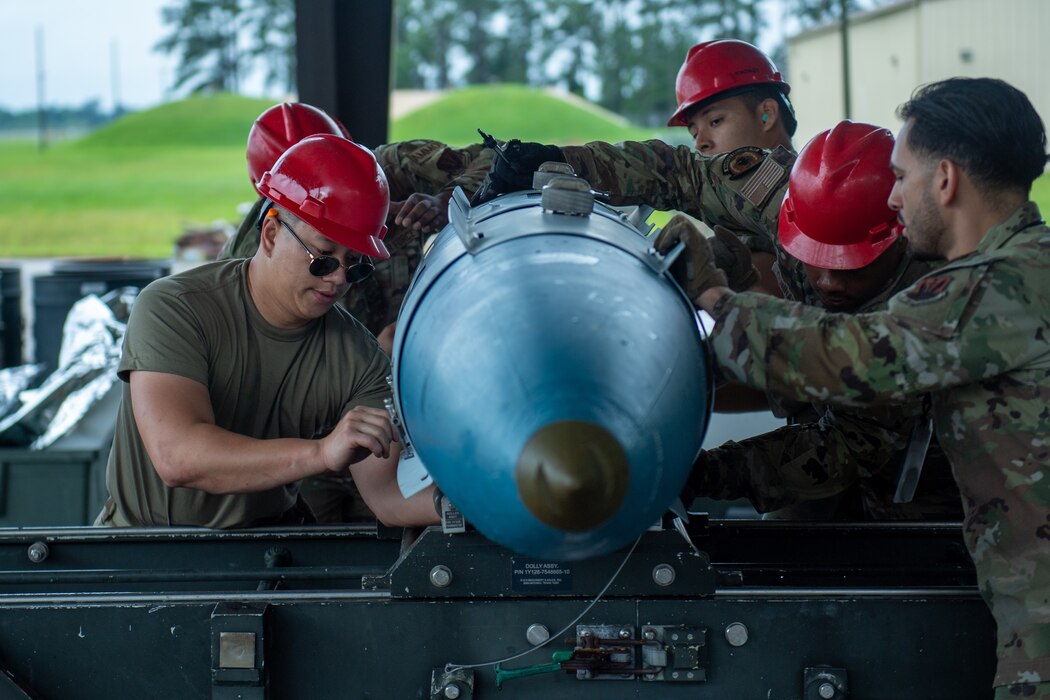 Airmen from the 23rd Munitions Squadron work on a GBU 31 V1 at Moody Air Force Base, Georgia, May 14, 2024.Airmen from Robins AFB attended the training to learn how to safely and efficiently build munitions. (U.S. Air Force photo by Airman 1st Class Cade Ellis)