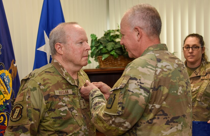 Pennsylvania Adjutant General Maj. Gen. Mark Schindler, right, presents the Pennsylvania Distinguished Service Medal to Maj. Gen. Michael Regan Jr. May 9, 2024, at Fort Indiantown Gap, Pa. Regan retired after 42 1/2 years of service, the last 7 1/2 at Deputy Adjutant General - Air of the Pennsylvania National Guard. (Pennsylvania National Guard photo by Tom Cherry)