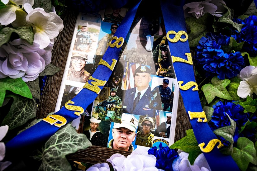 A collage of fallen service members is displayed by the 87th Security Forces Squadron during an opening ceremony for Police Week at Joint Base McGuire-Dix-Lakehurst, N.J., May 13, 2024. In 1962, President John F. Kennedy proclaimed May 15 as National Peace Officers Memorial Day and the calendar week in which May 15 falls, as National Police Week.