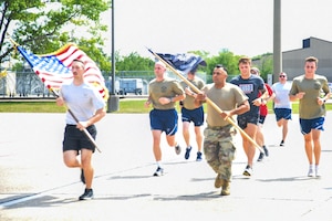 Air Force Reserve members run on flightline.