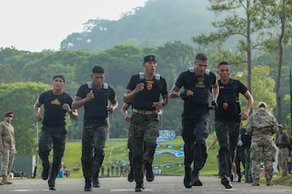 Members of Team Honduras push through the challenge presented by the 2-mile run segment of the Fuerzas Comando 24 (FC24) Physical Test in Cerro Tigre, Panama, May 14, 2024.