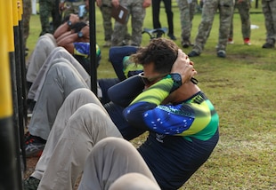 Brazilian competitors complete sit ups as part of the Fuerzas Comando 24 (FC24) Physical Test in Cerro Tigre, Panama, May 14, 2024.