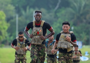 Team Belize runs together during the 2-mile run event of the Fuerzas Comando 24 (FC24) Physical Test in Cerro Tigre, Panama, May 14, 2024.