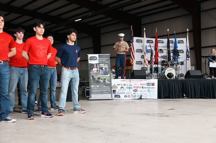 U.S. Marine Corps Capt. Jacob Layton, the executive officer of Recruiting Station Kansas City conducts the oath of enlistment during the 9th Annual Friends In Service of Heroes Armed Forces Celebration Day at New Century, Kansas on May 4th, 2024. Sgt.Maj. Ruiz visited the current command and the future officers and enlisted Marines of Recruiting Station Kansas City prior to giving remarks at the AFD event. AFD, annually conducted by FISH, serves as an event to recognize and honor service members and veterans who have chosen duty, honor, and country to protect our freedoms. (U.S. Marine Corps photo by Sgt. Alexis Moradian)